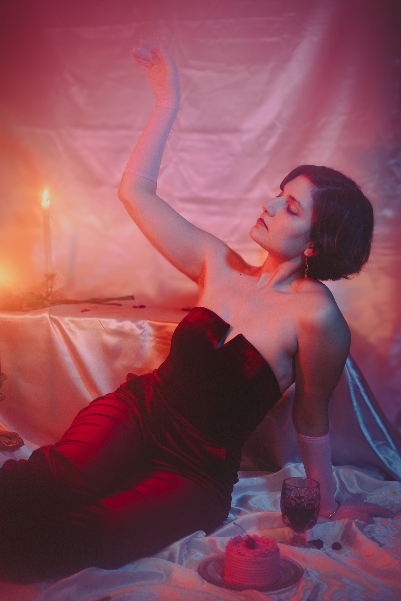 Model posing confidently in a relaxed indoor setting, with natural light highlighting their outfit and personality