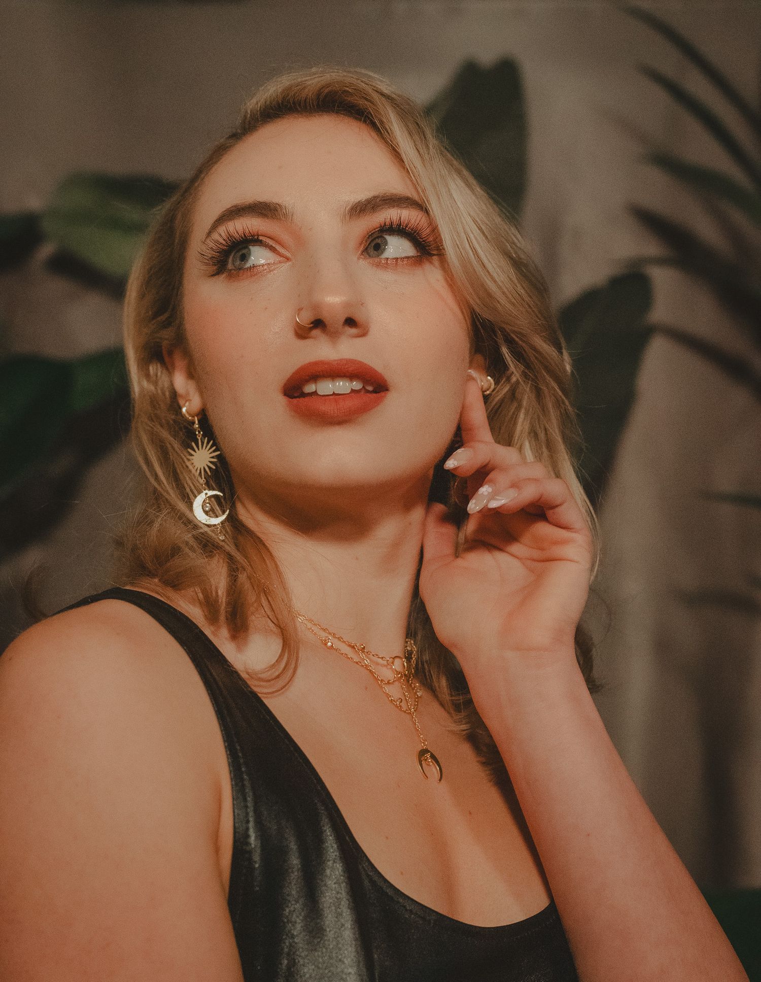 Portrait of a model in a creative photoshoot, showcasing a confident pose and expressive styling.