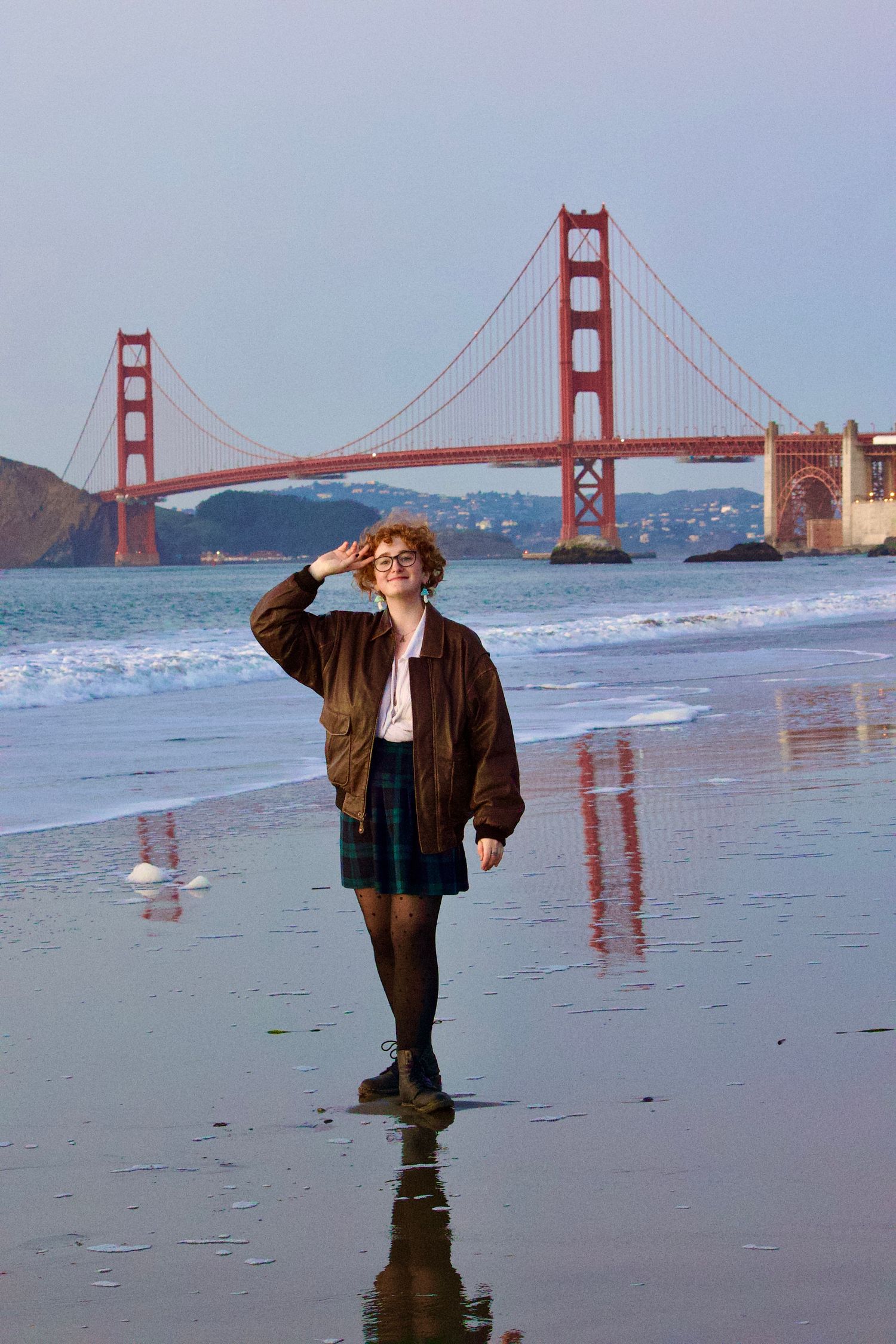 Model posing in from of Golden Gate Bridge in San Francisco.