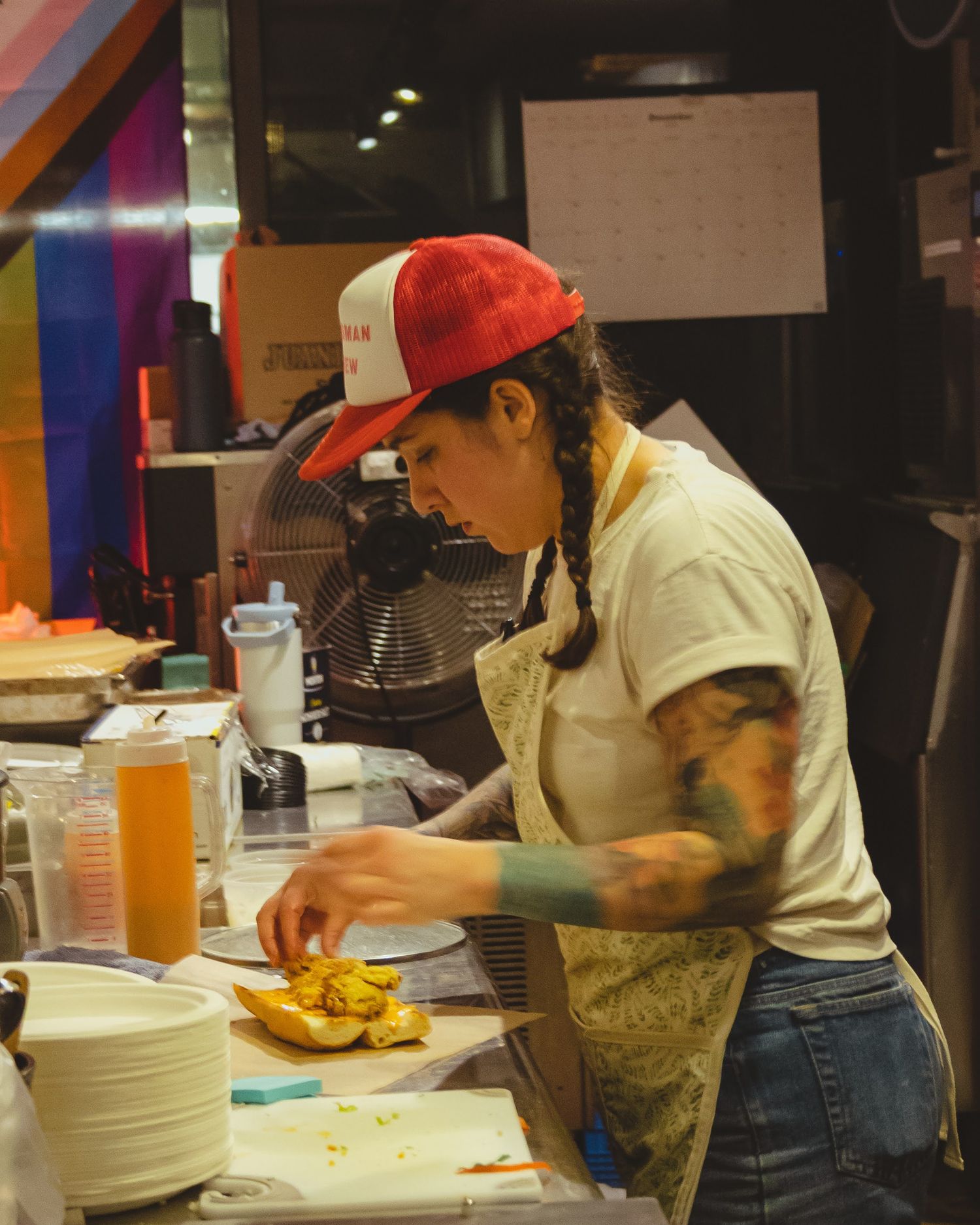 Close-up of a chef expertly plating a gourmet dish in a bustling kitchen, with steam rising from the fresh ingredients.
