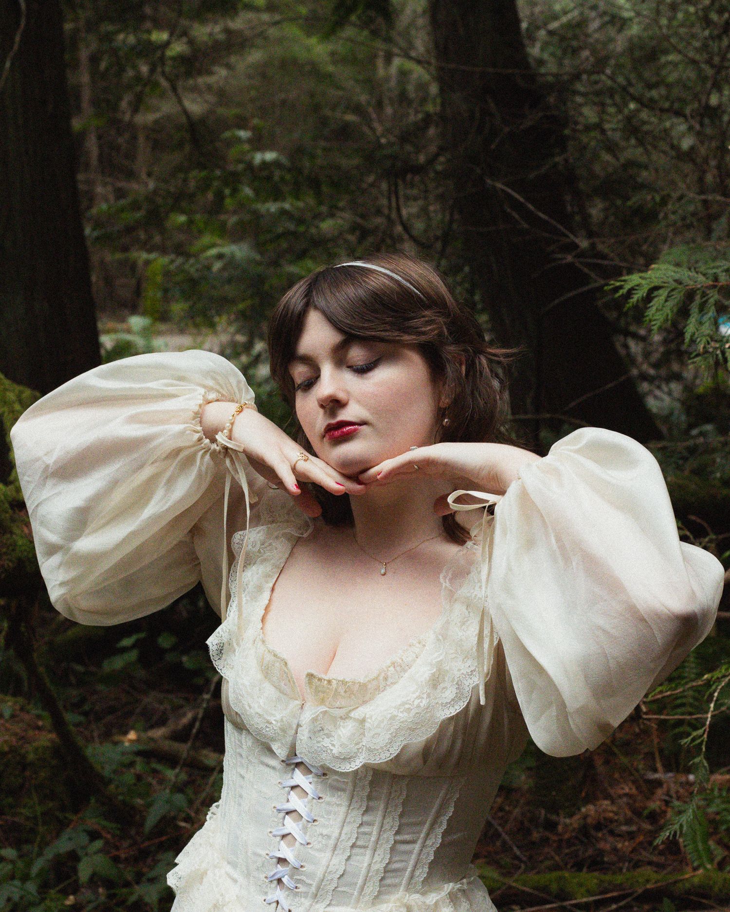 Model in a flowy dress, twirling in a magical outdoor setting with soft light and dreamy, whimsical vibes