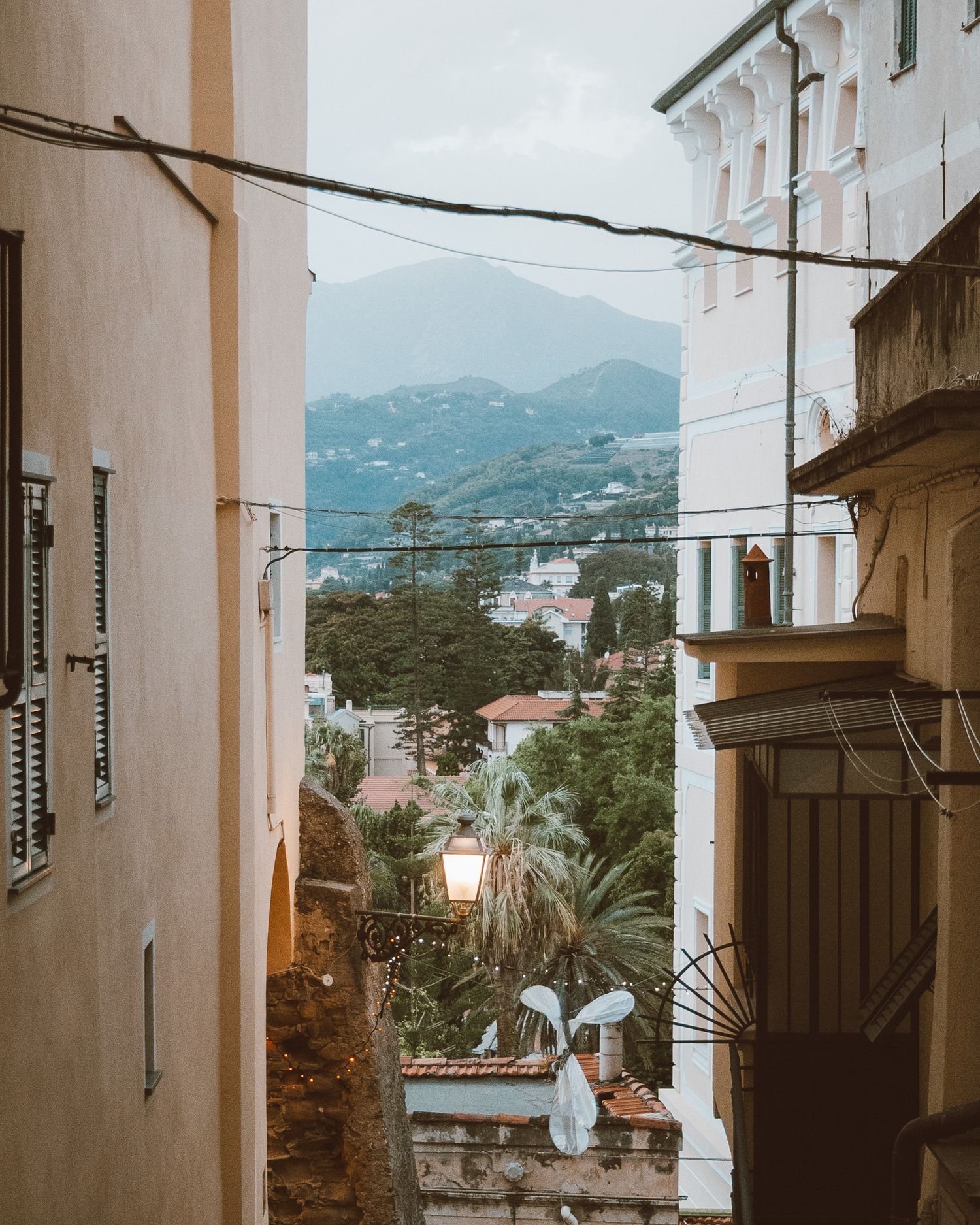 Captured moment of a rustic Italian village, with winding streets and historic stone architecture bathed in sunlight.