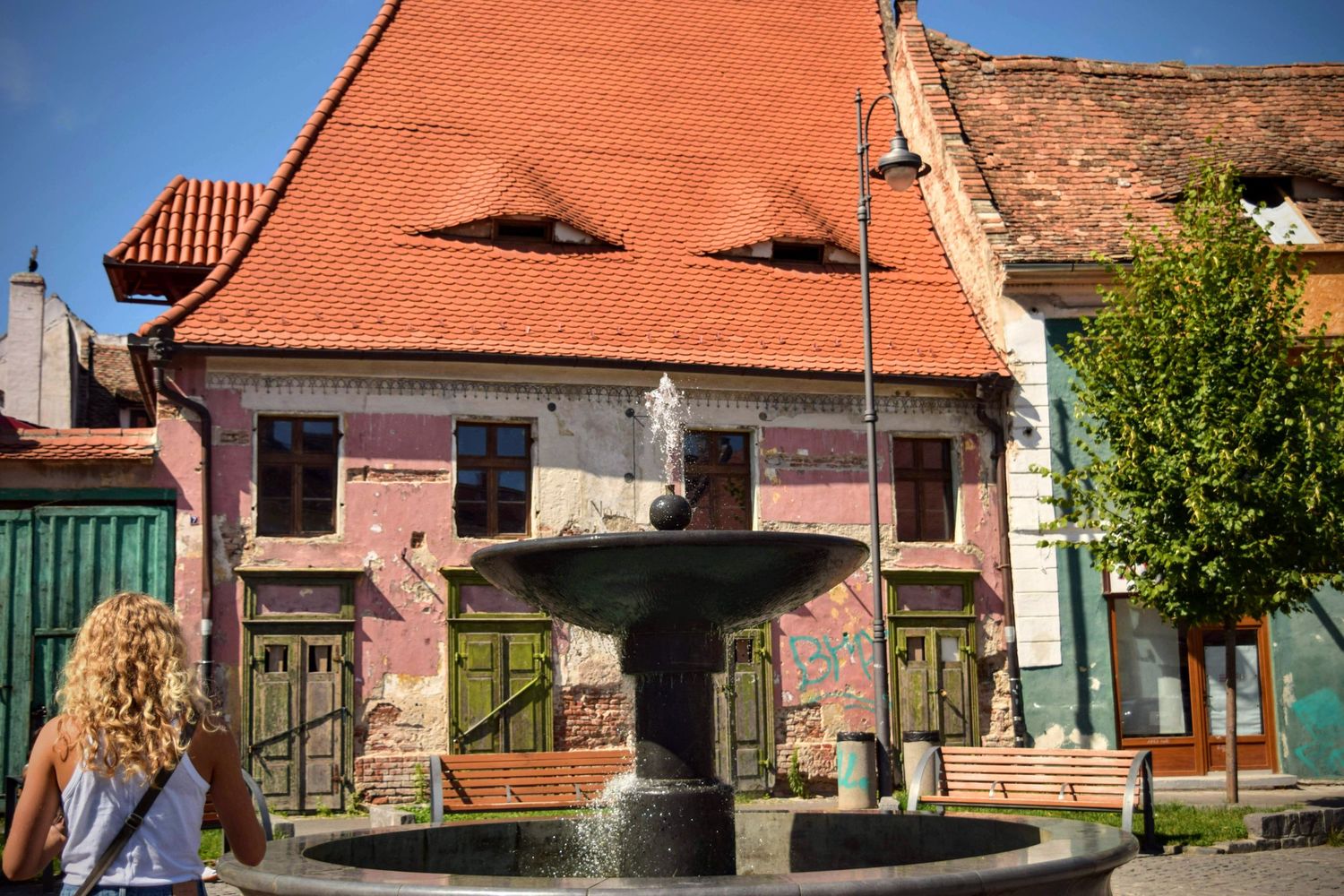 Vibrant street market in Eastern Europe, with stalls full of local goods and people going about their day