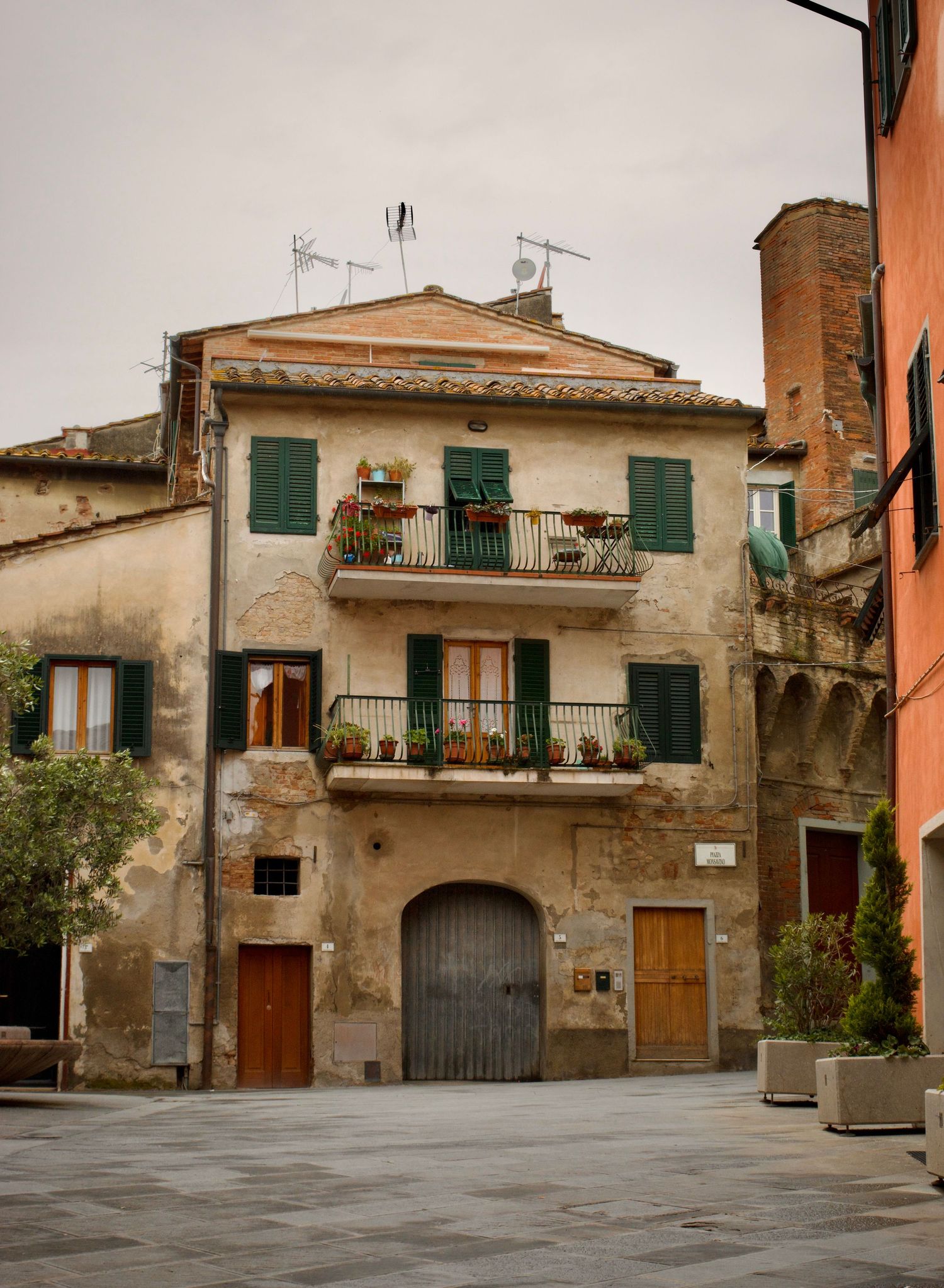 Vibrant street scene in Italy, with ancient ruins blending into modern life under the warm European sun.