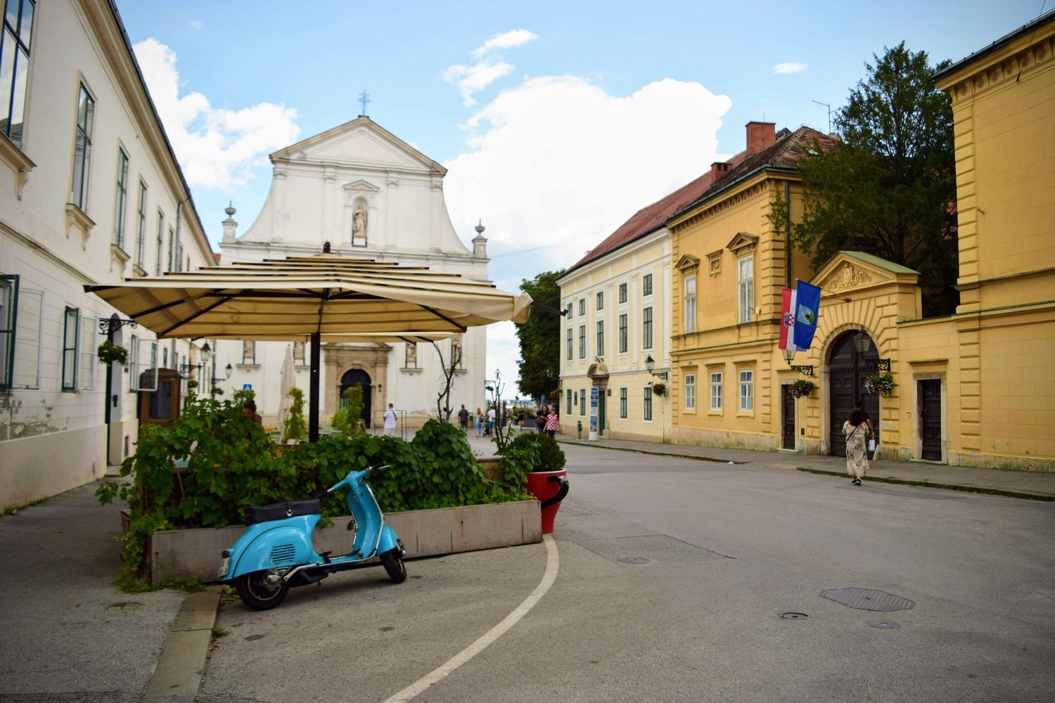 Charming cobblestone streets of a historic Eastern European city, with colorful buildings and lively street scenes.