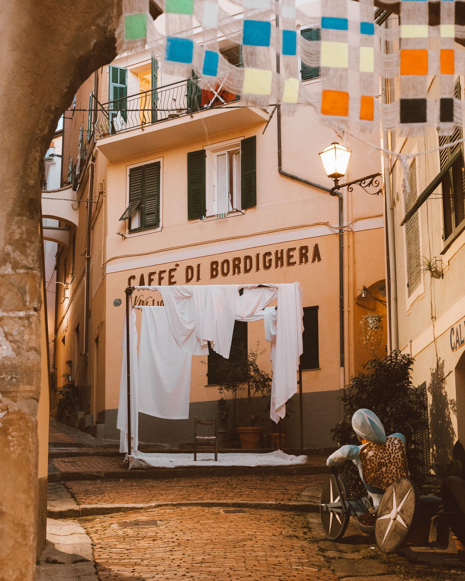 The warmly lit streets of Bordighera, Italy.