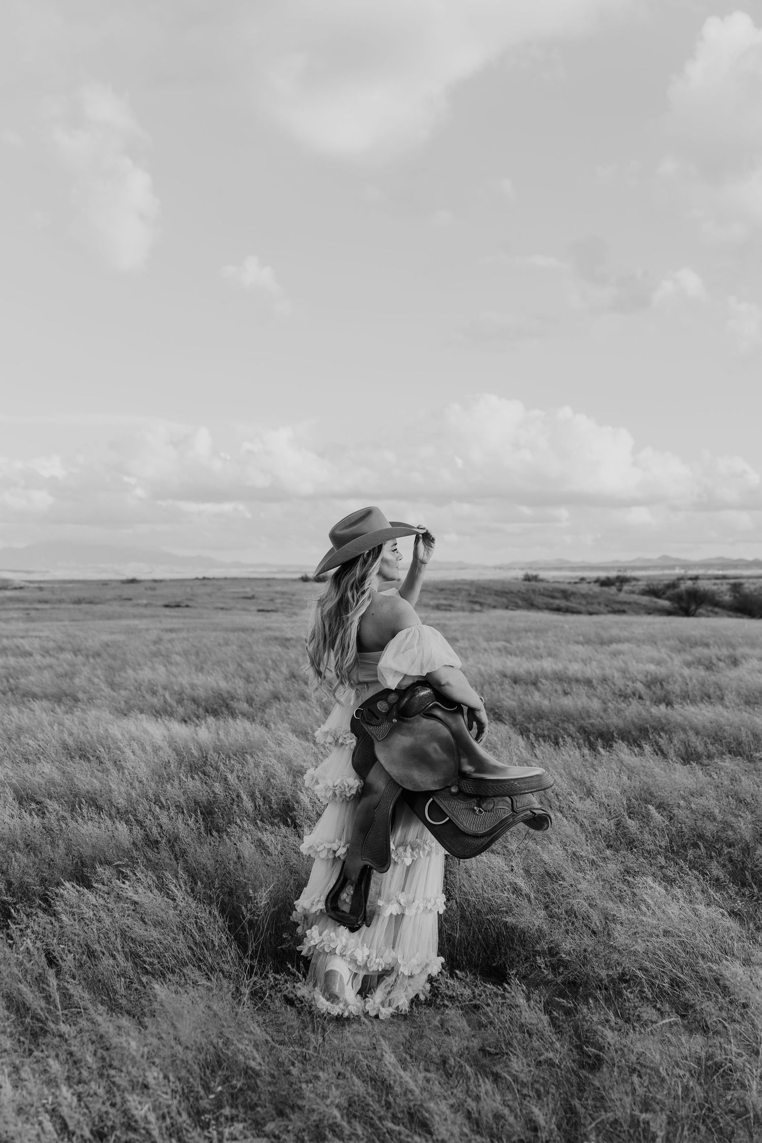 Black and white photo sequence of a person falling off a horse in a grassy field.