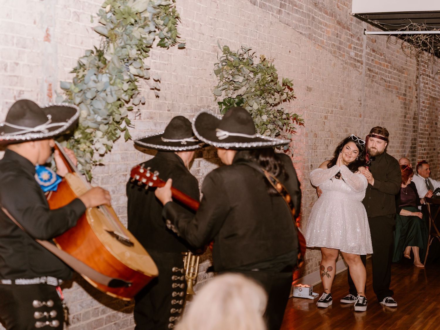 Wedding reception dance party with mariachi band surprise for the bride.