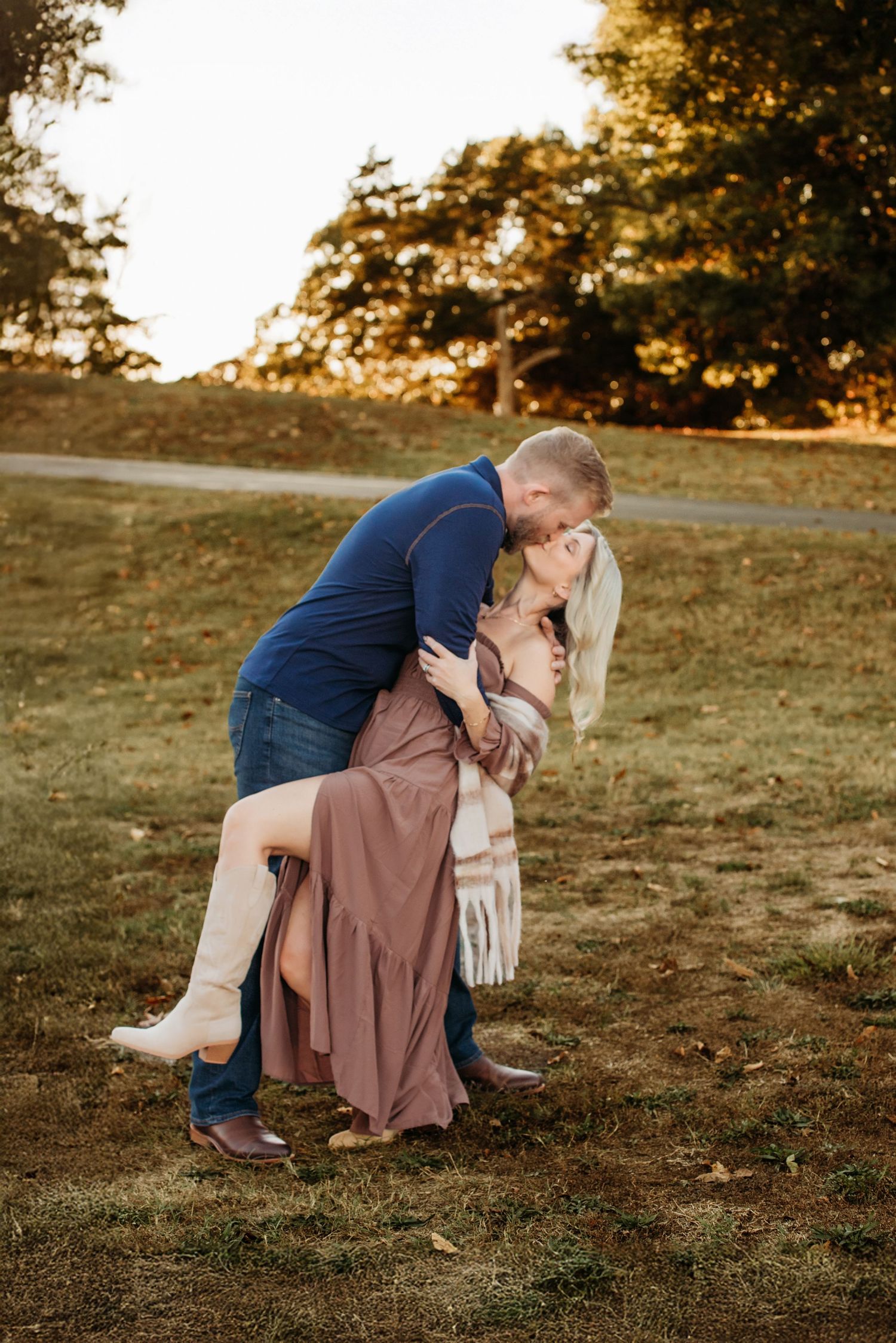 Romantic sunset photoshoot showing dip poses in golden hour lighting.