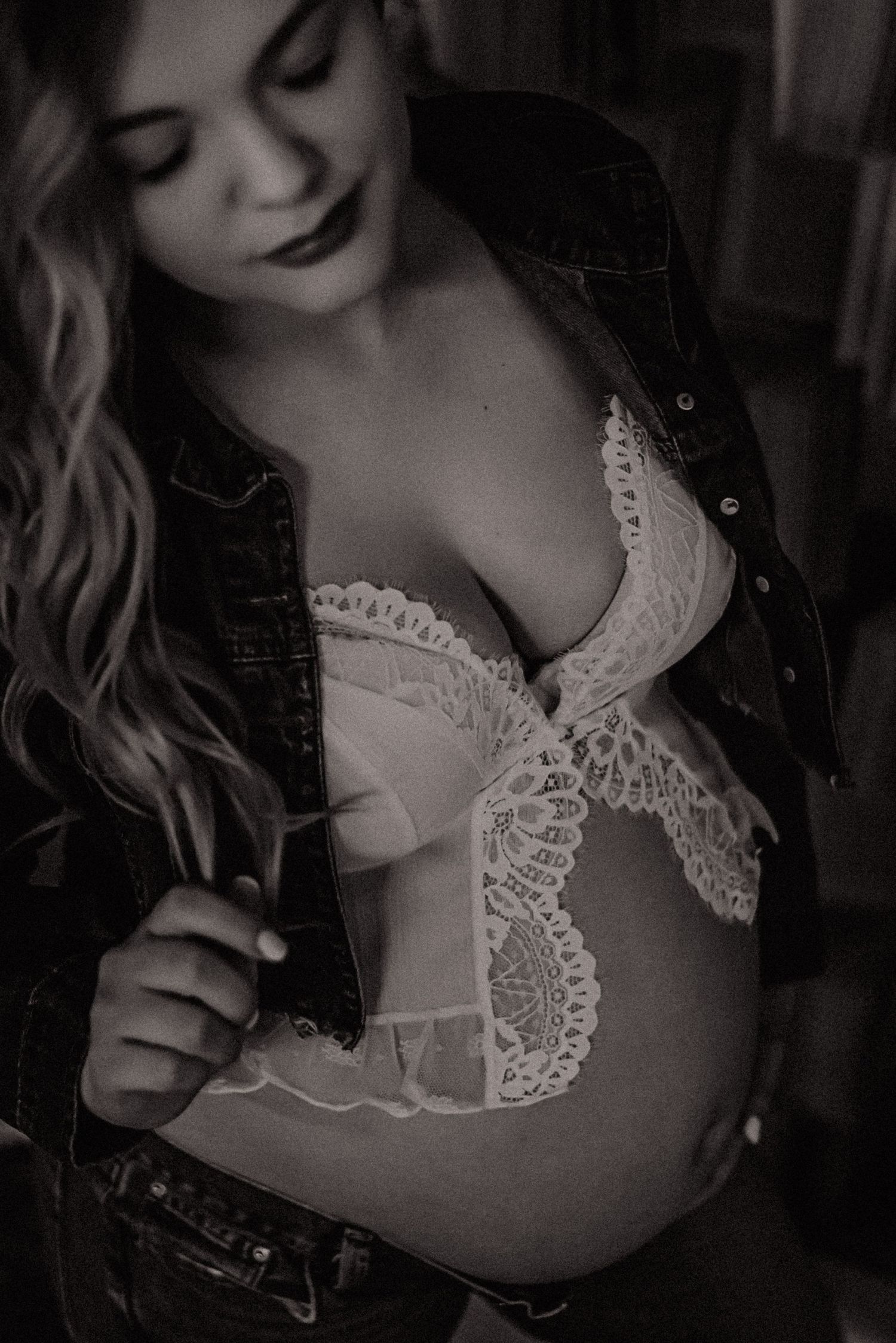 Black and white artistic portrait series showing delicate lace details on clothing in moody lighting.