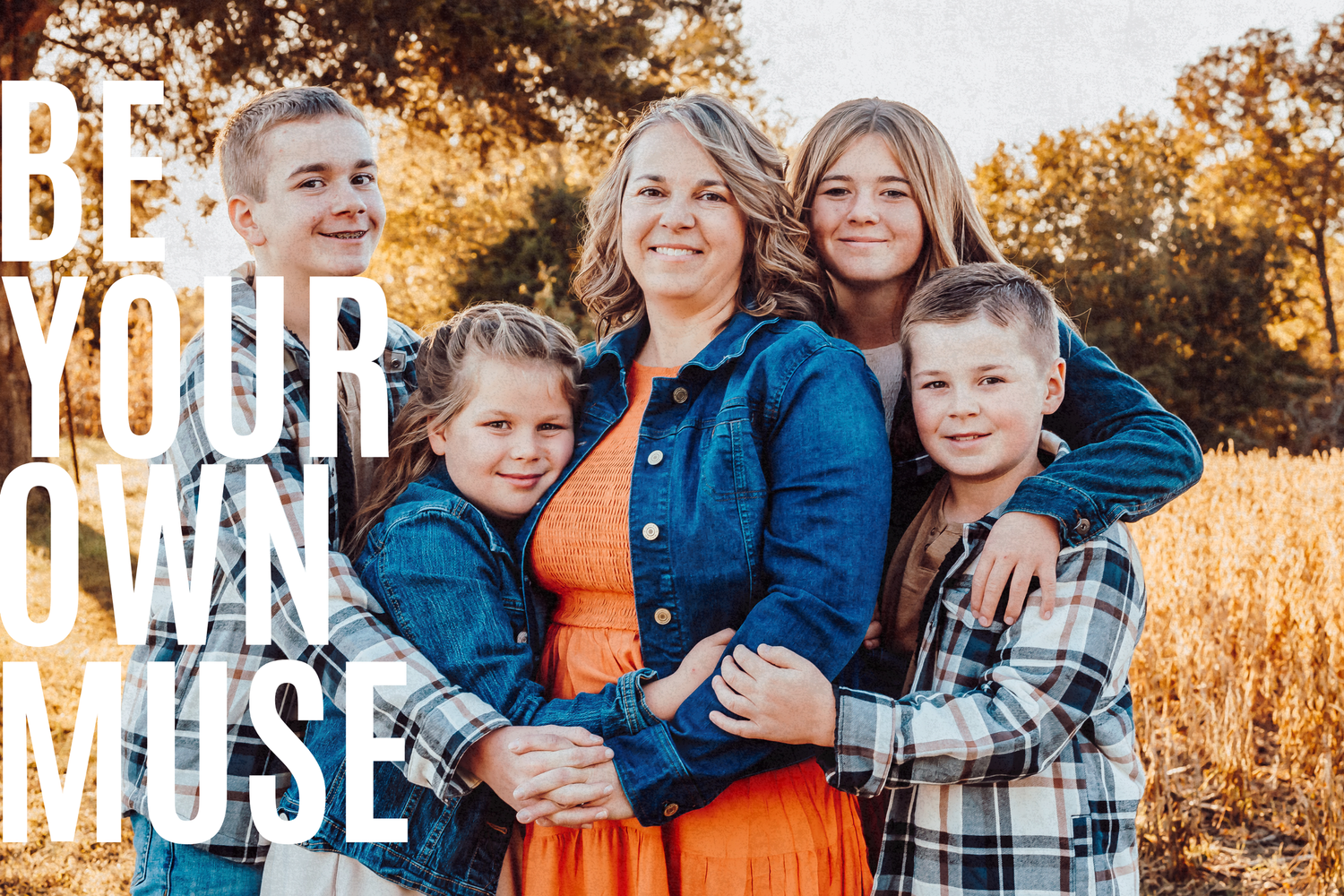 Family group photo with text overlay reading 'BE YOUR OWN MUSE' in white letters.
