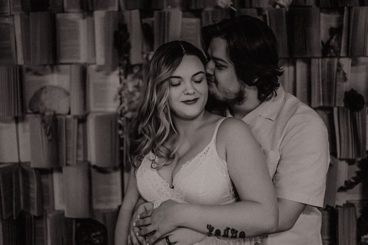 A black and white photo series showing intimate wedding moments with couples embracing and celebrating their special day.