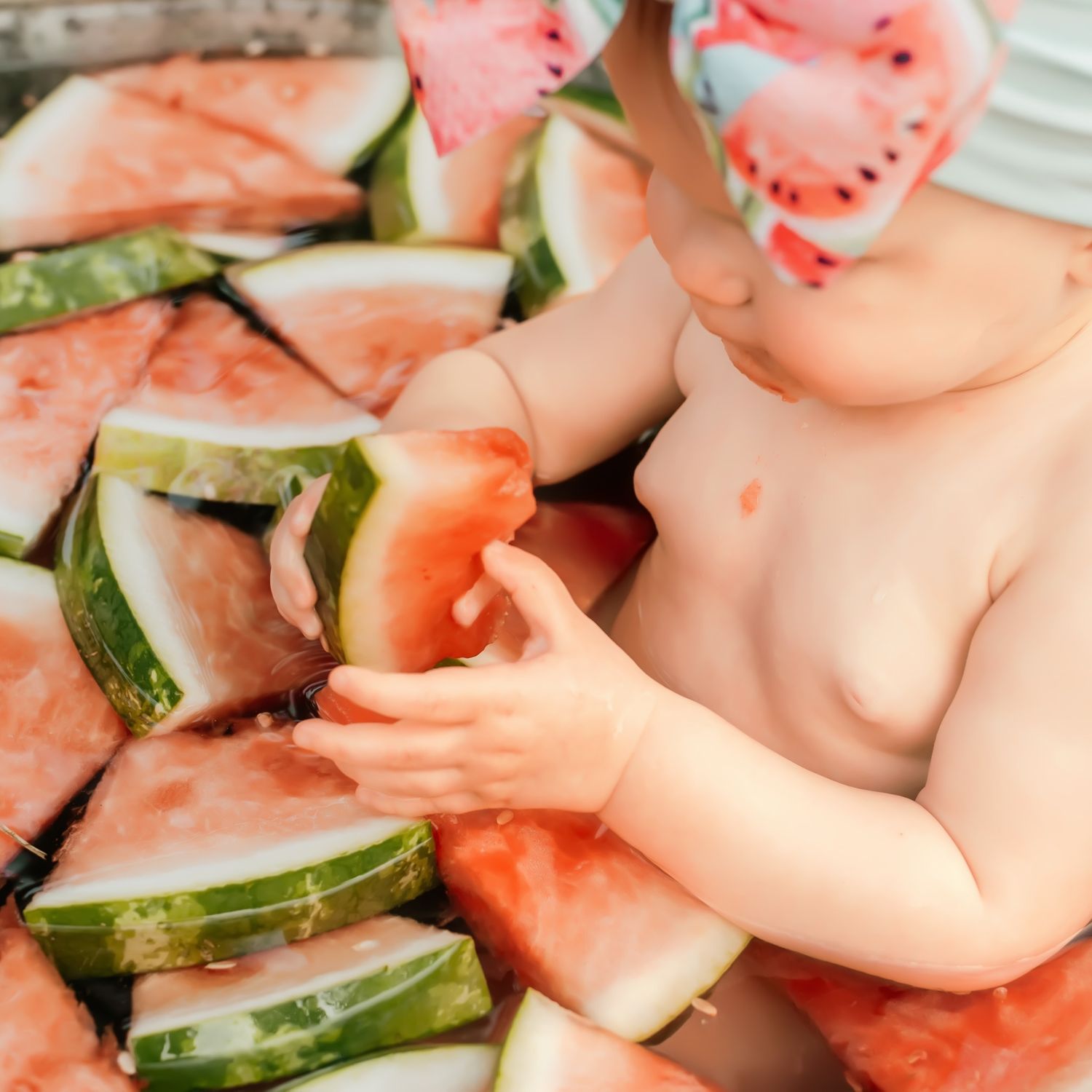 Fresh slices of pink watermelon and cucumber arranged in a pattern.