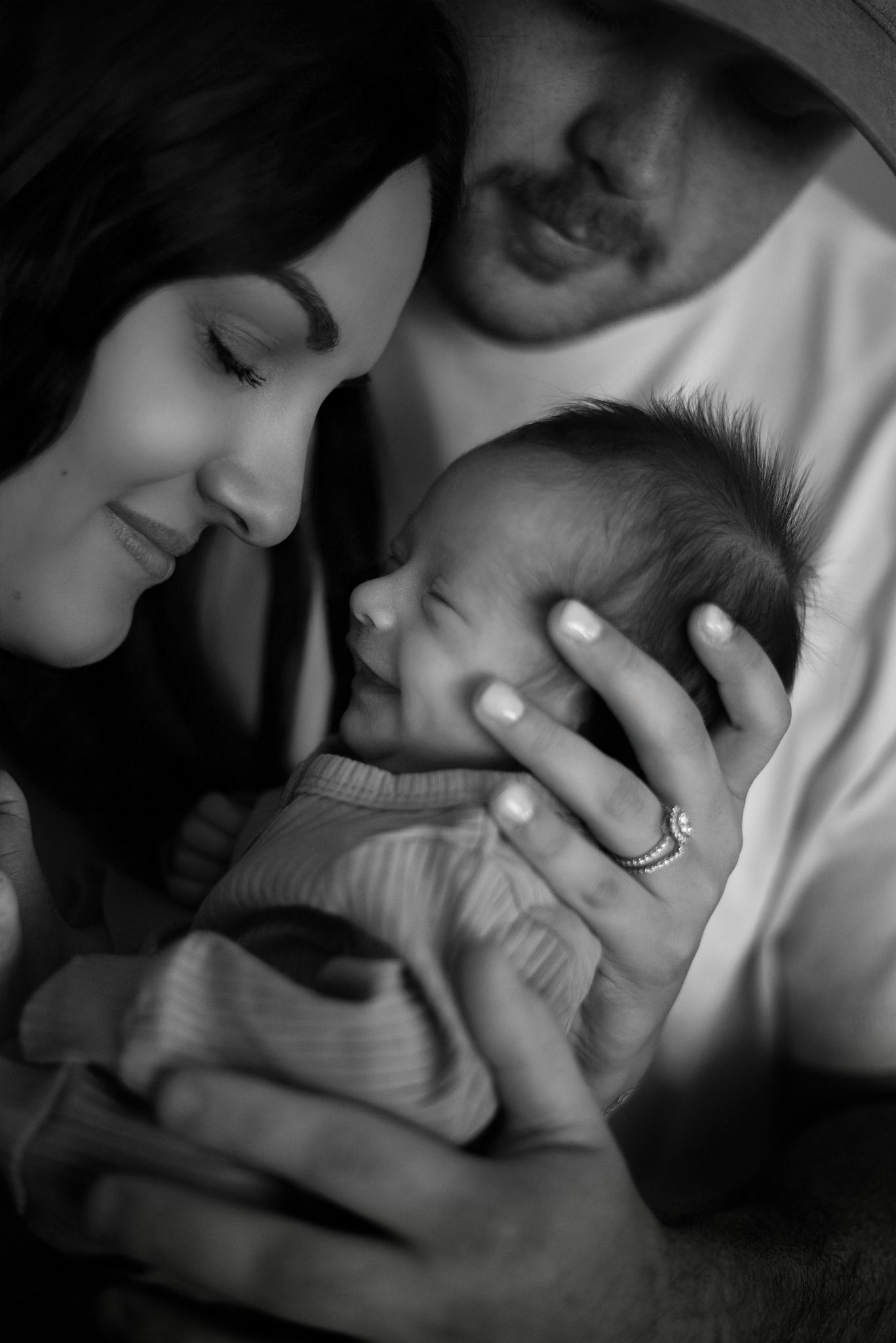 Intimate black and white portrait showing tender moments between a couple.