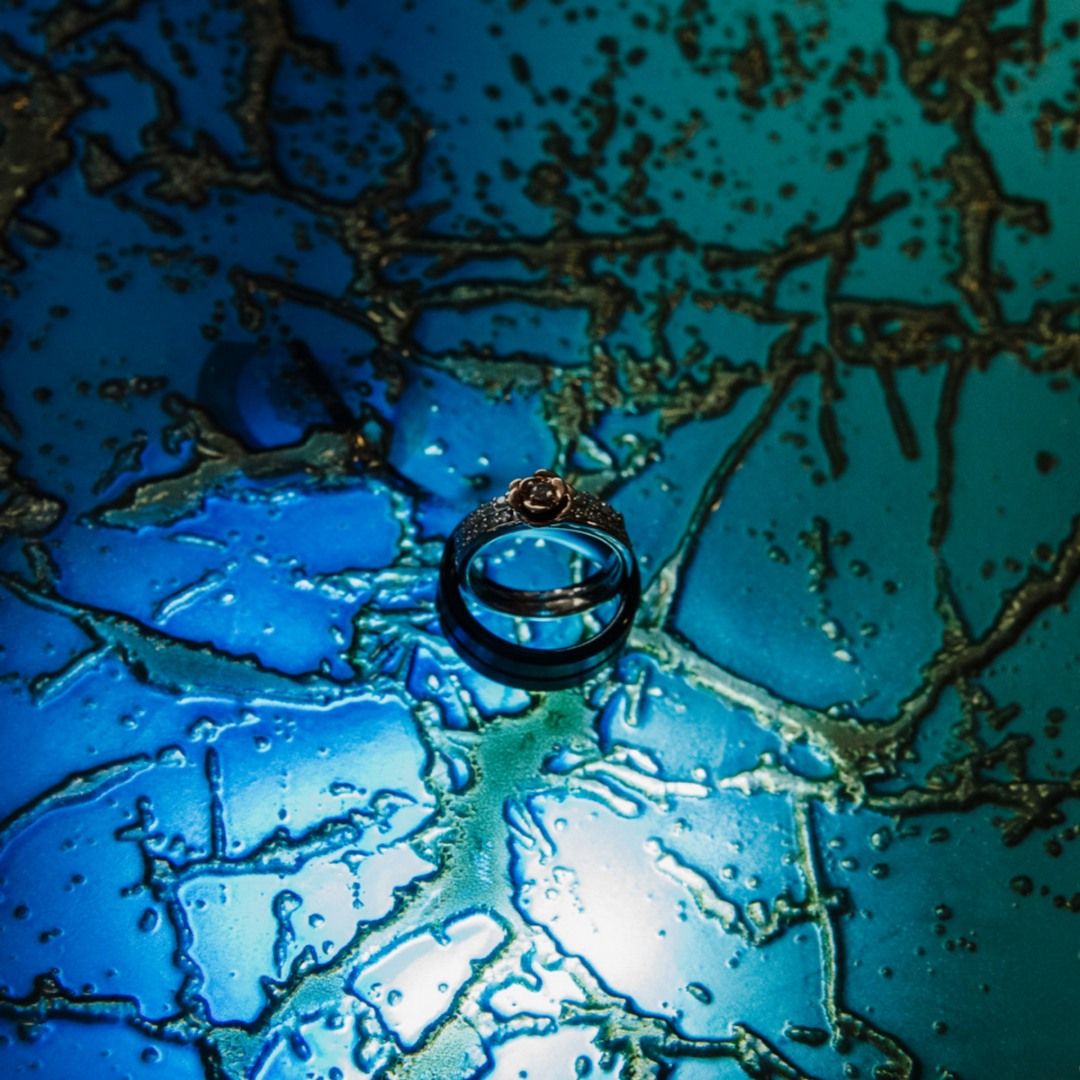 Abstract blue and turquoise water droplets creating artistic patterns.