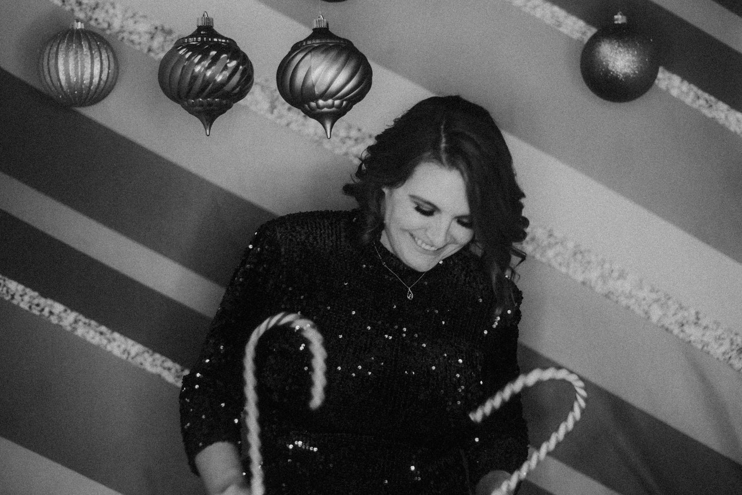 Black and white photo series showing figures in dramatic lighting with ornate decorations.