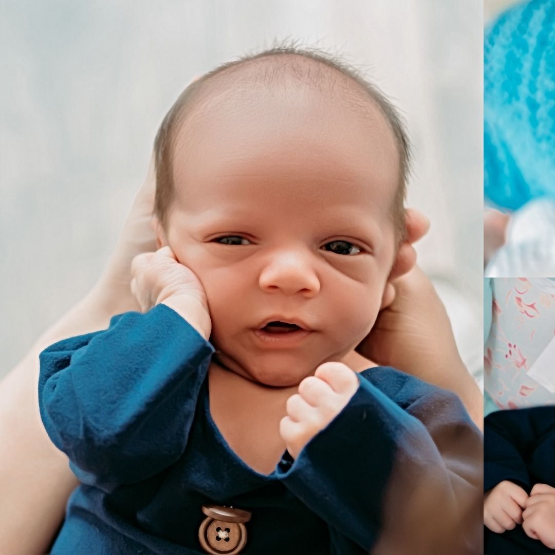 Close-up portrait shots of an infant wearing a navy blue outfit with buttons.