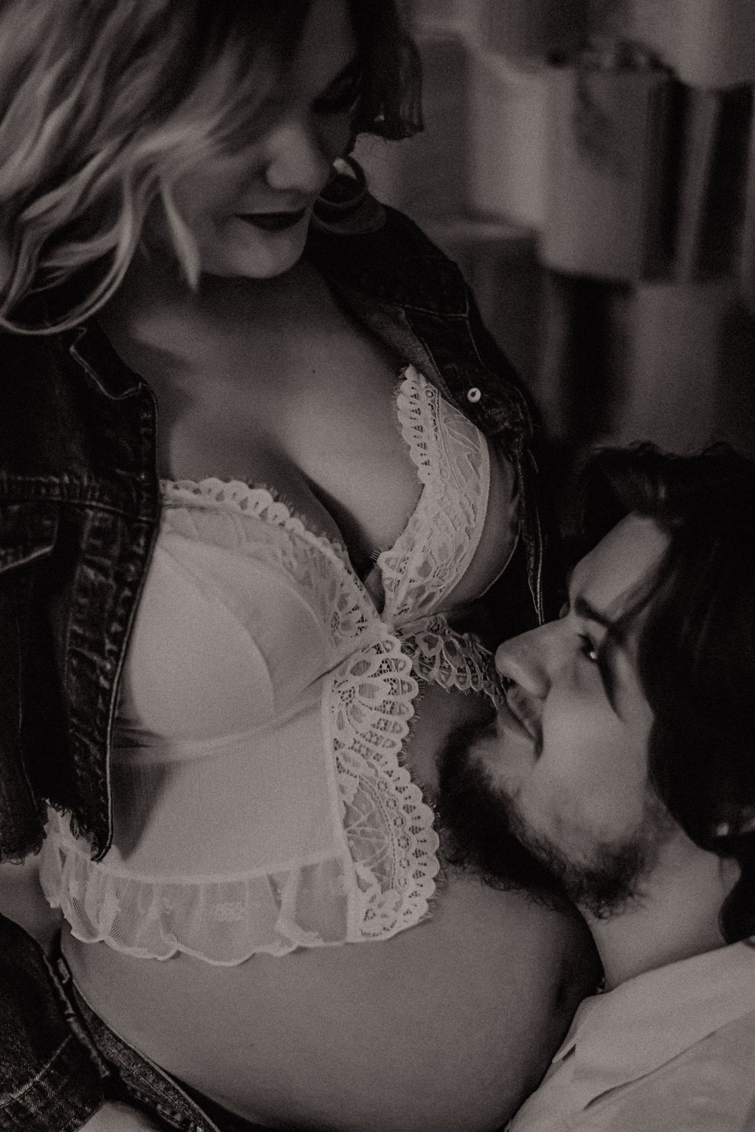 A tender black and white photo series showing a breastfeeding moment between parent and infant.