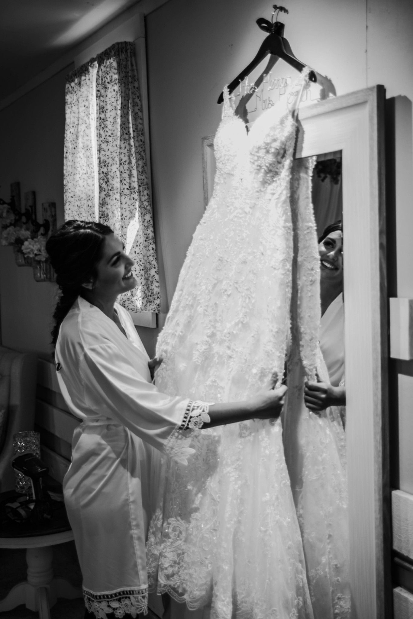 Black and white photos of wedding dress preparations before the ceremony.