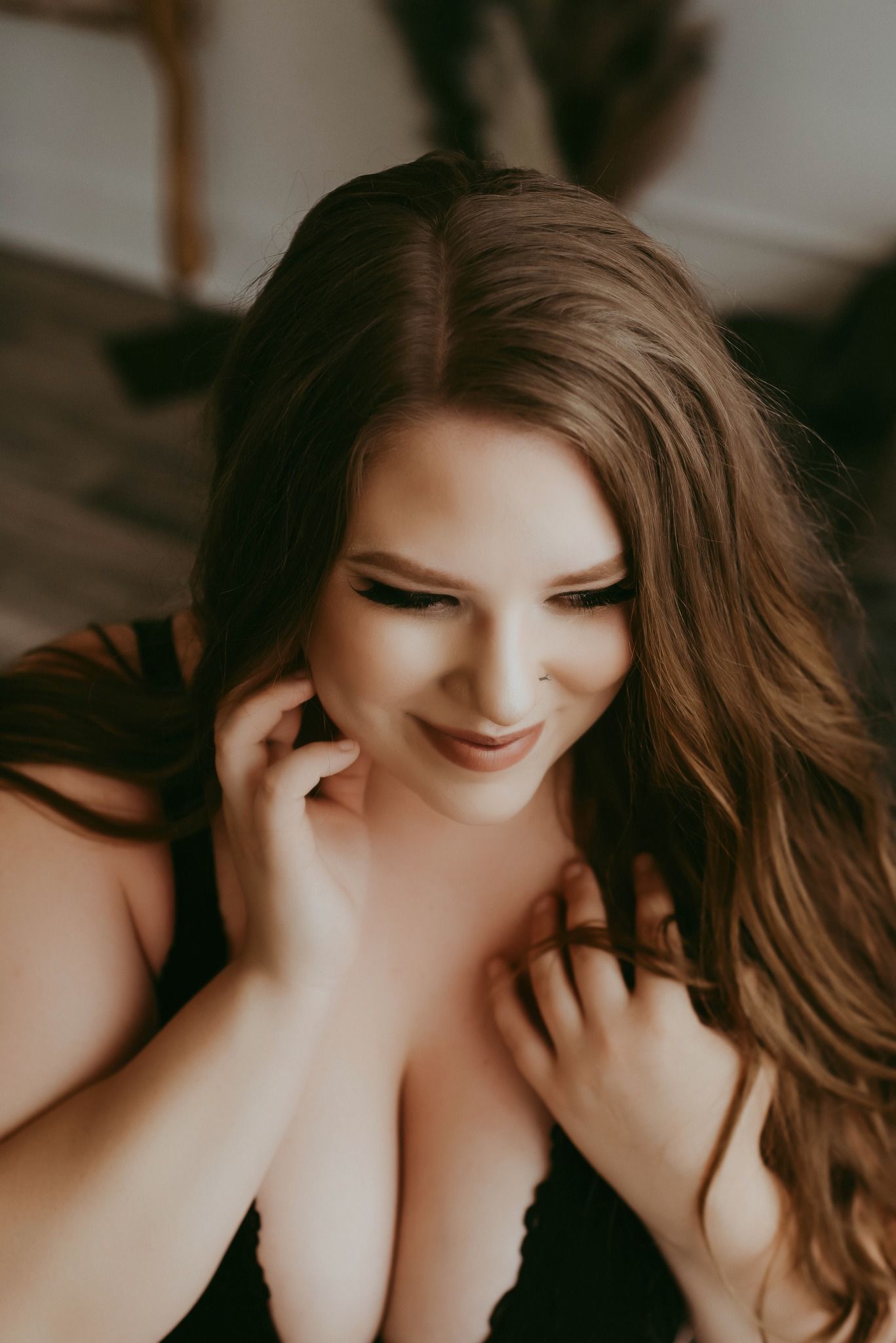 Artistic boudoir photography with soft lighting and intimate poses.