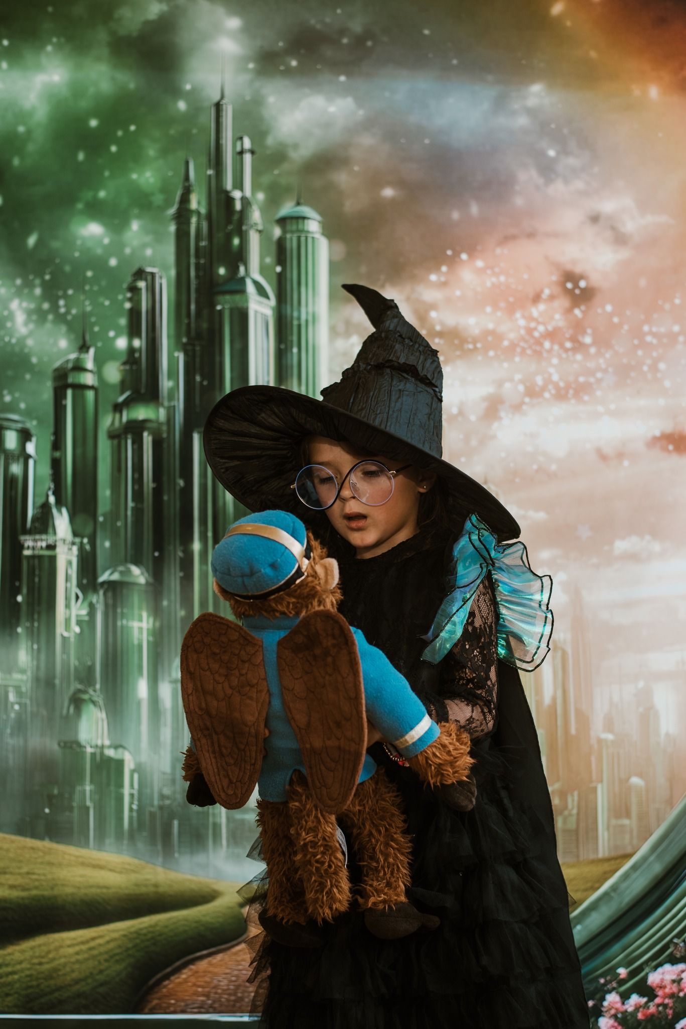 A fantasy cityscape with emerald towers and a brown dog wearing blue goggles against a dramatic sky.