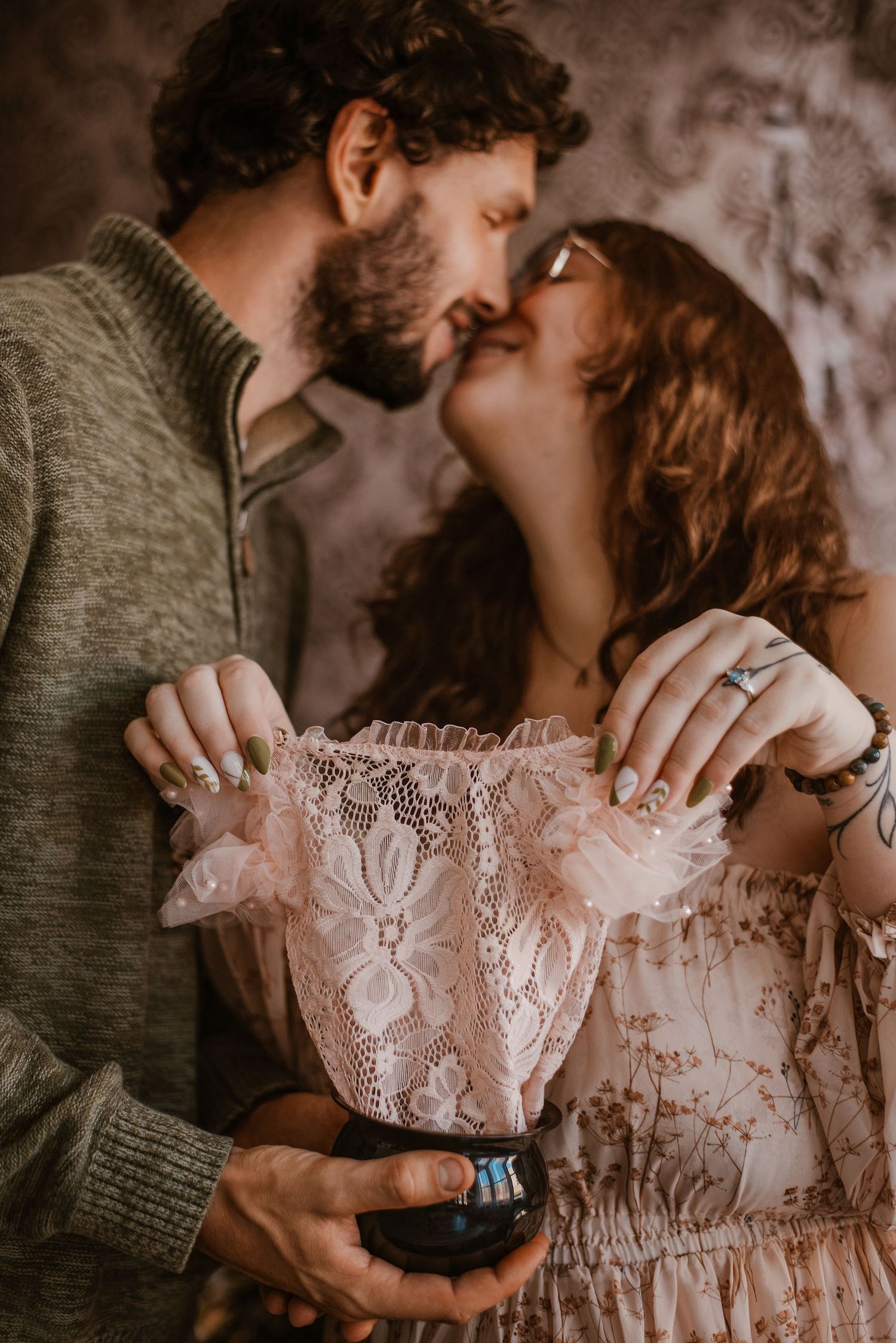 Intimate couple's portrait session with vintage lace dress details.