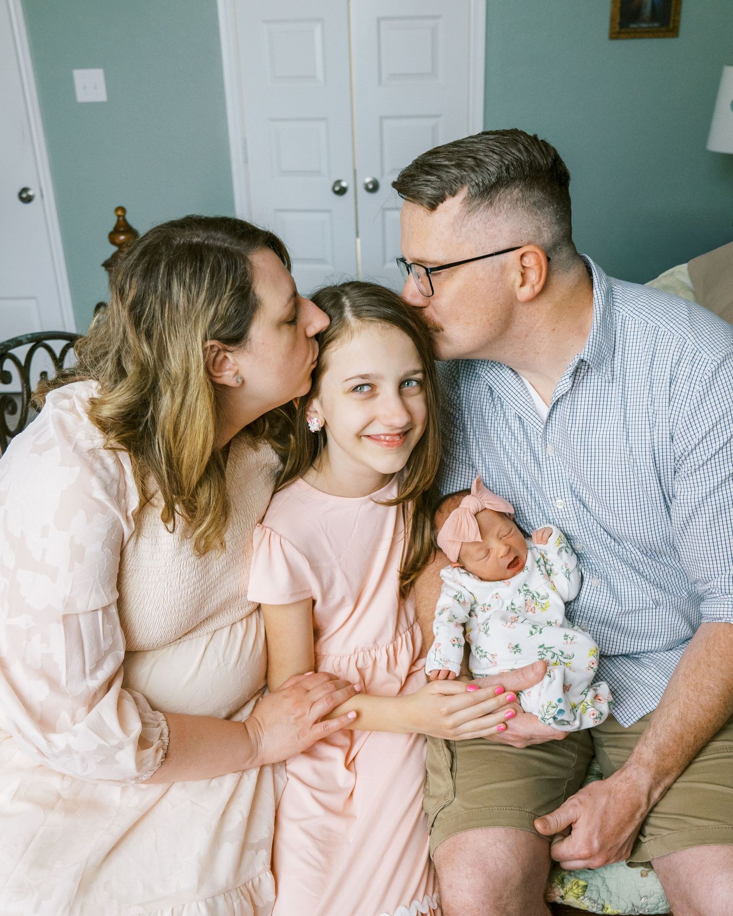 Candid family moments captured in series against mint green walls and natural lighting.