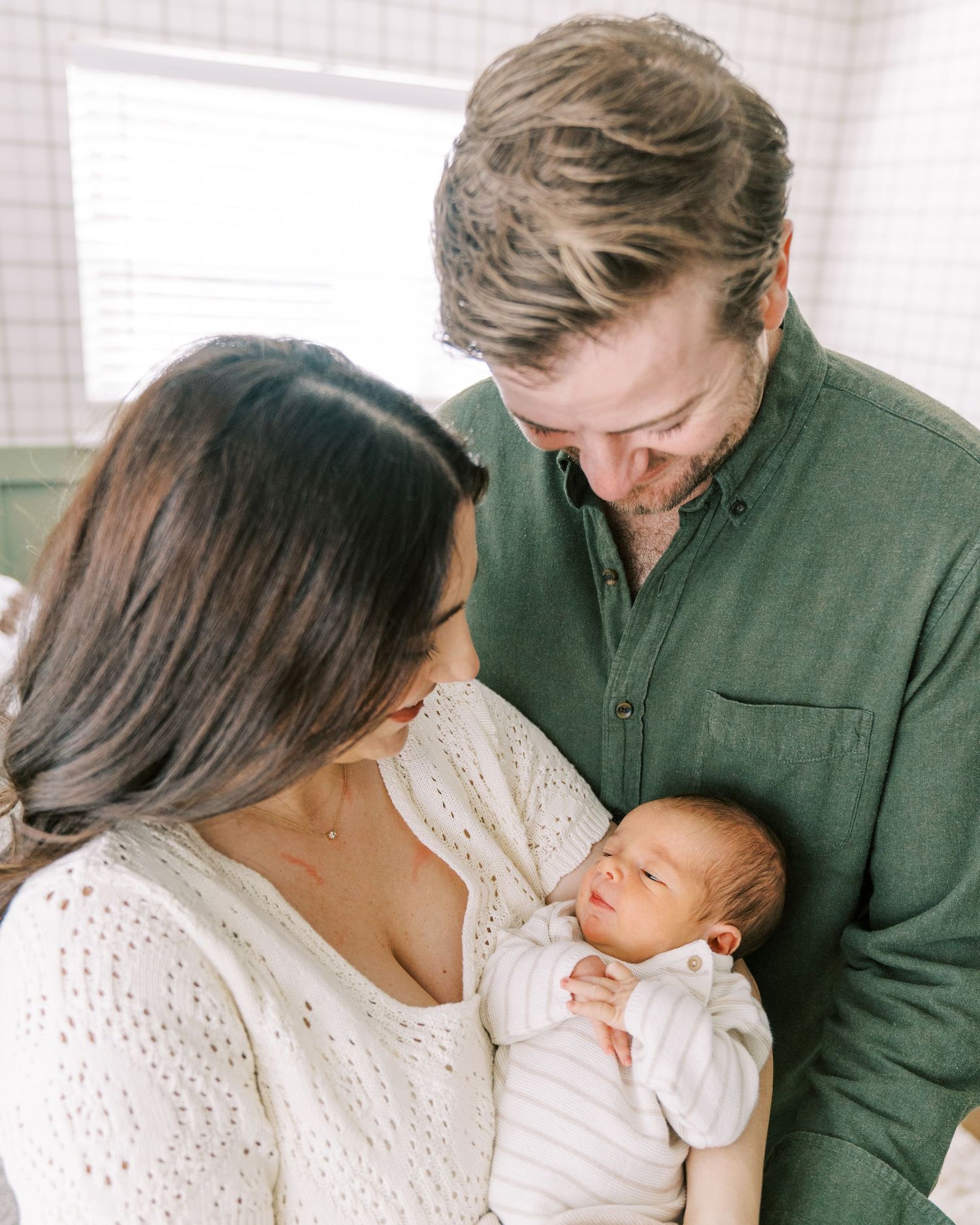 A series of tender family moments with parents and newborn baby shown in soft, intimate photographs.