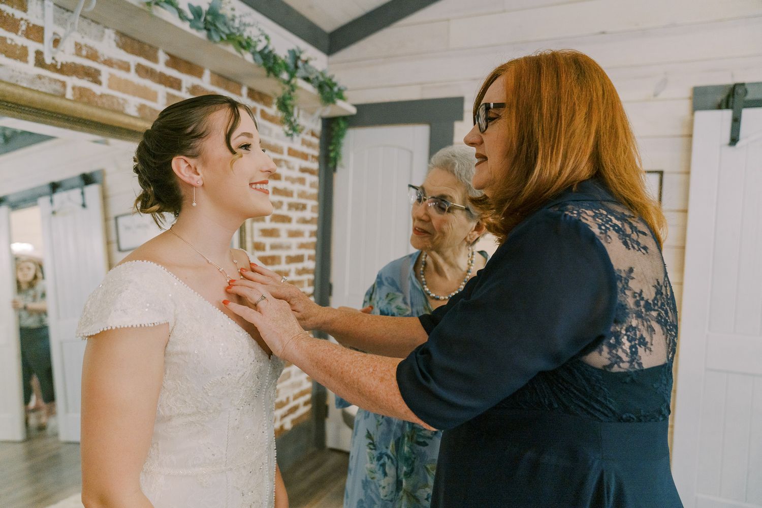 A series of candid wedding moments showing embraces and celebrations in an elegant indoor venue.