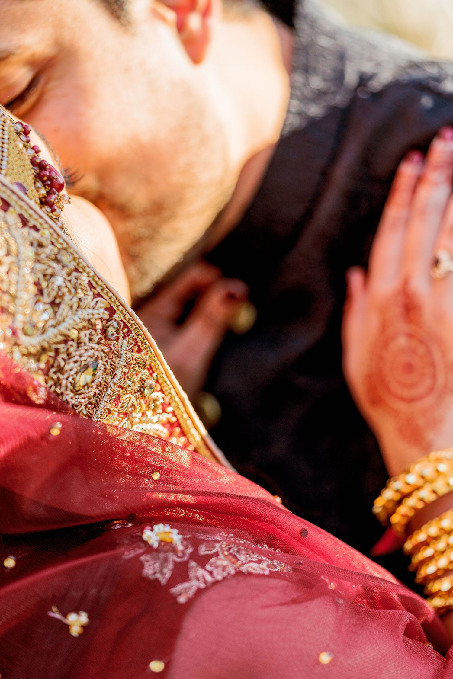 Detail shots of traditional South Asian bridal attire with red and gold embellishments.