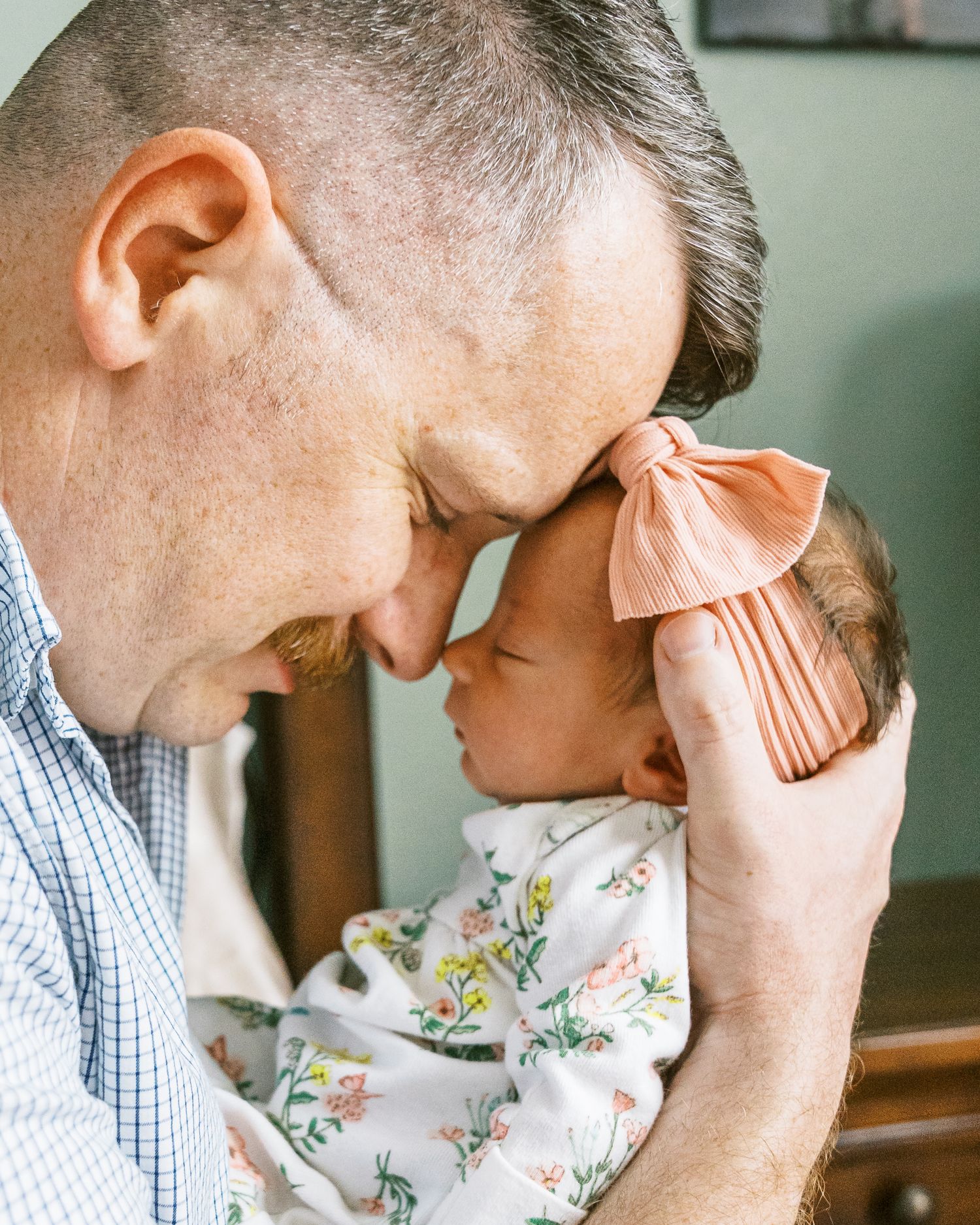 Close-up intimate moments between parent and child in casual attire.