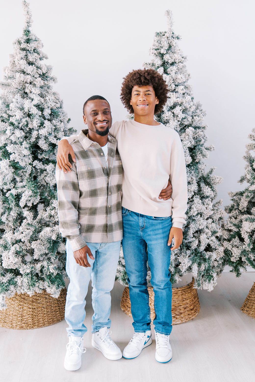 Three matching holiday photos with snow-covered Christmas trees and woven baskets in a bright white studio setting.