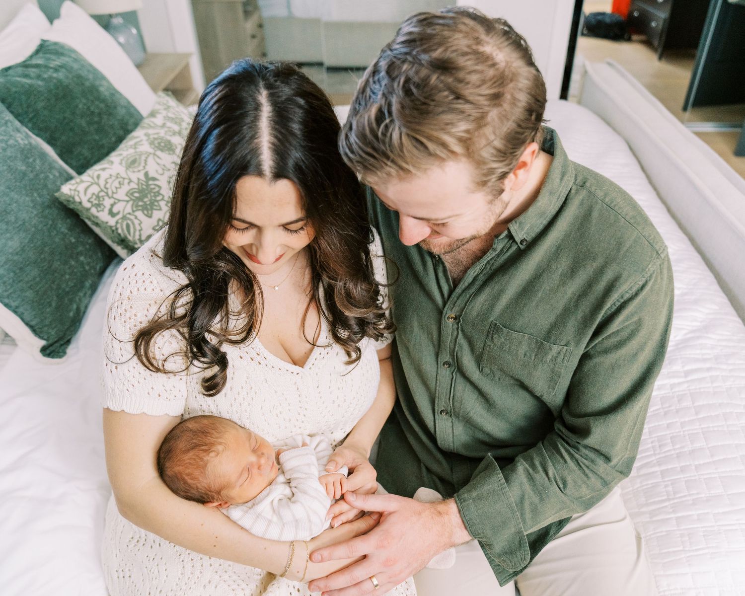 A series of tender family moments captured with a newborn baby in a home setting.
