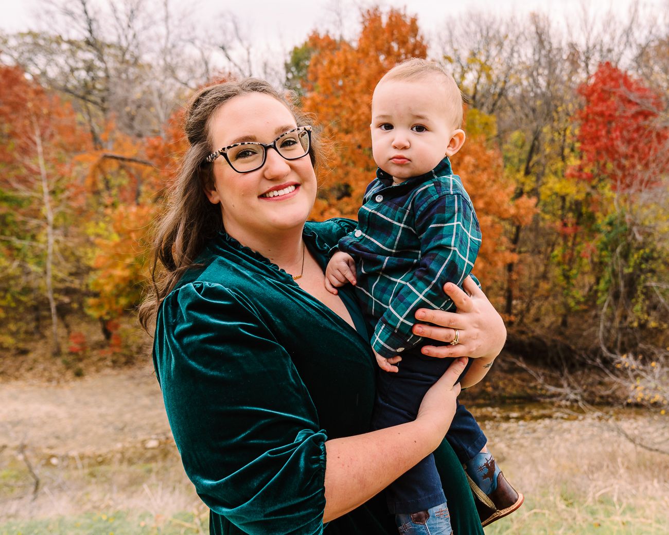 A series of candid autumn portraits showing joyful moments between parent and child against vibrant fall foliage.