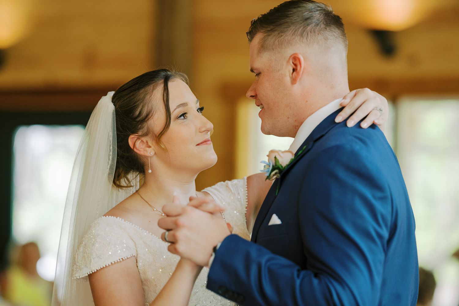 A romantic couple in wedding attire share intimate moments in a series of candid photographs.
