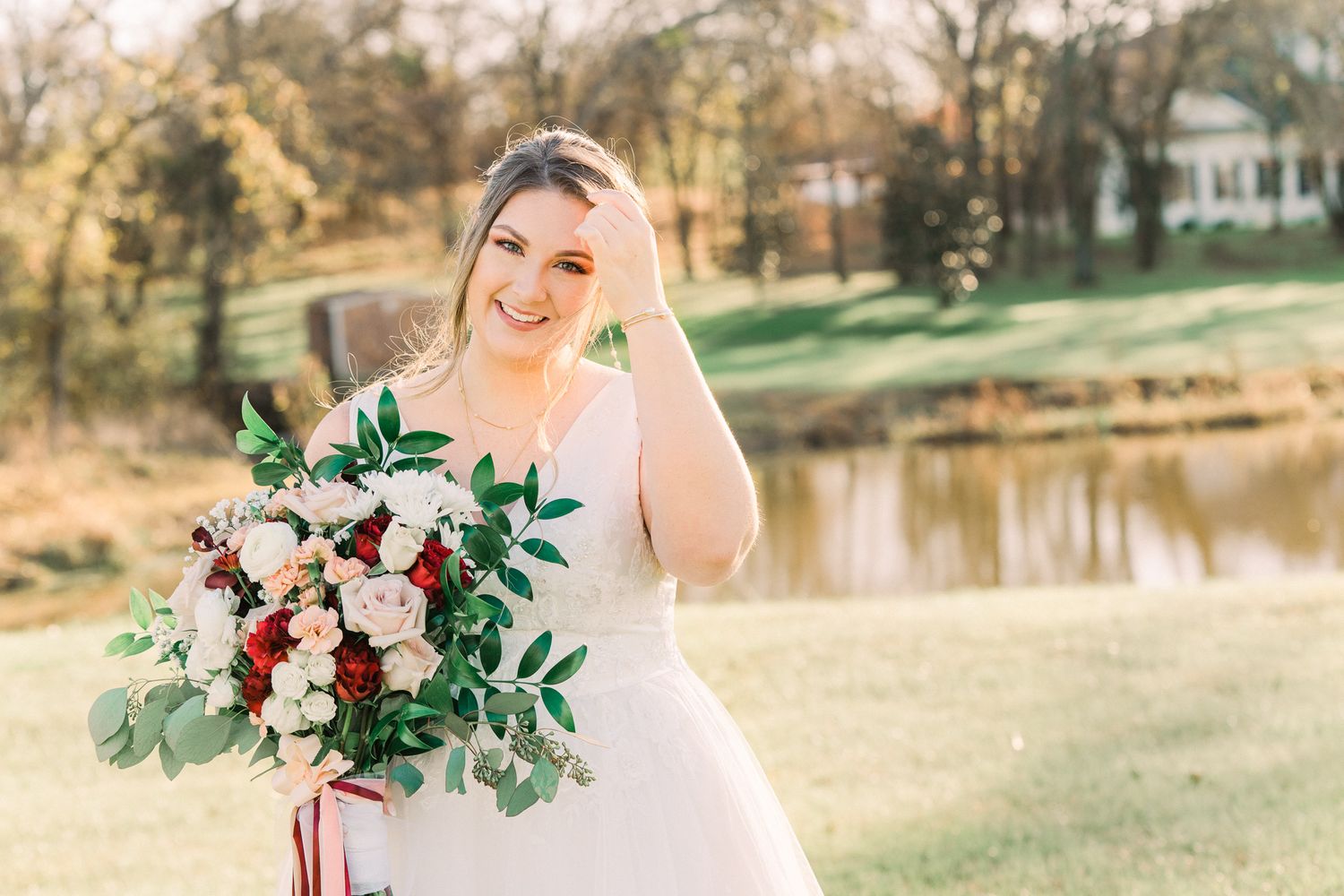Outdoor wedding ceremony setup with floral arrangements and natural greenery.