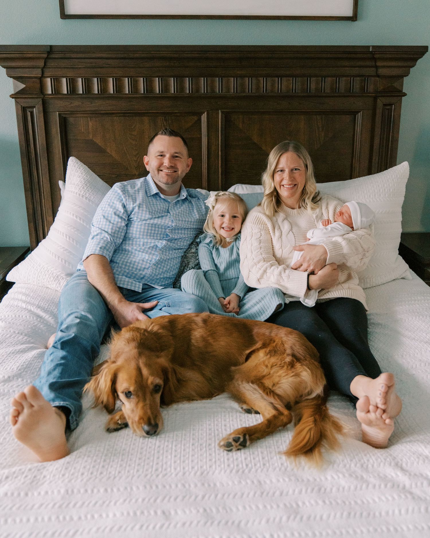 Family relaxing together on white bed with golden retriever dog showing progression of intimate moments.
