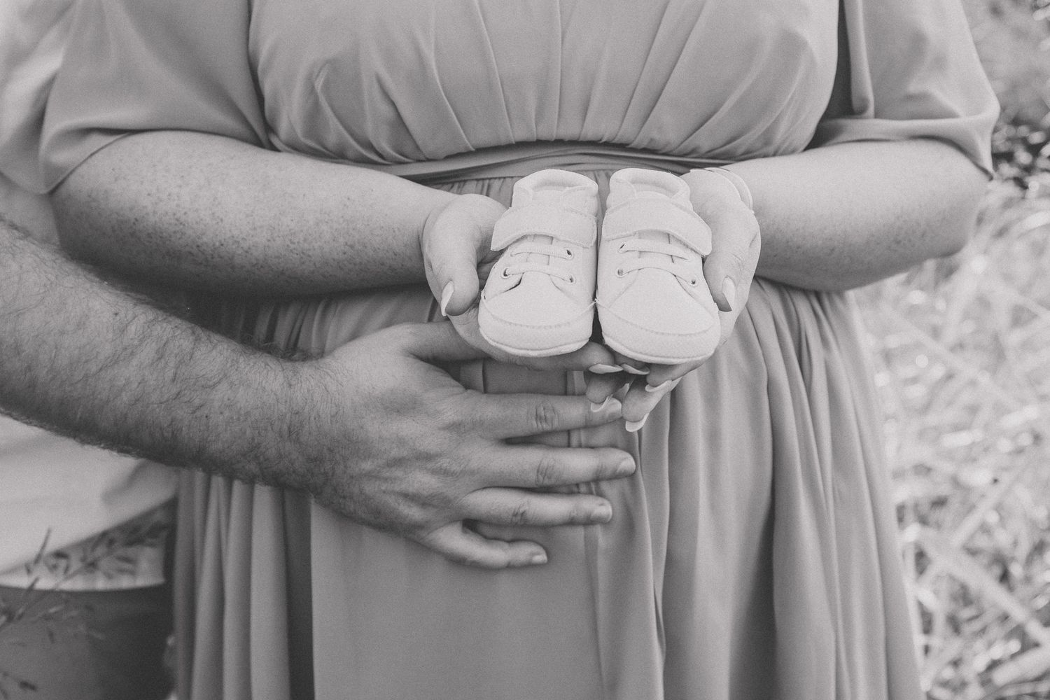 Close-up shots showing tender embraces and gentle touches in an outdoor setting.