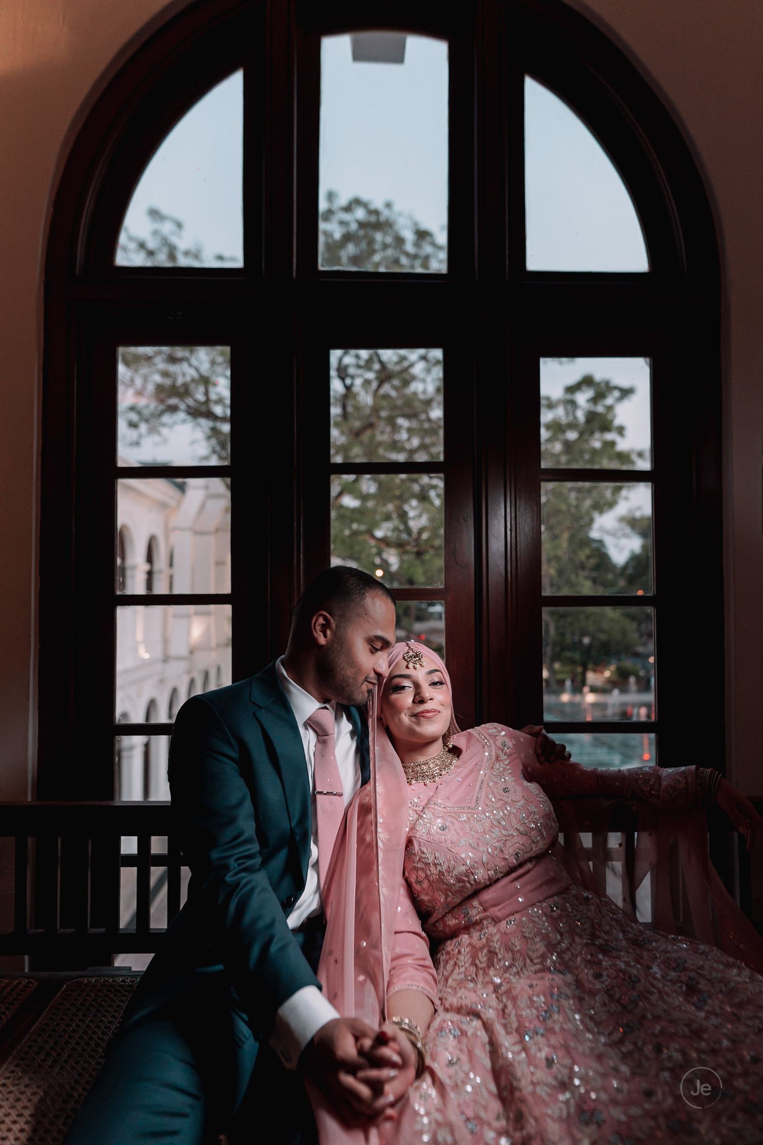 Groom embracing his bride with love