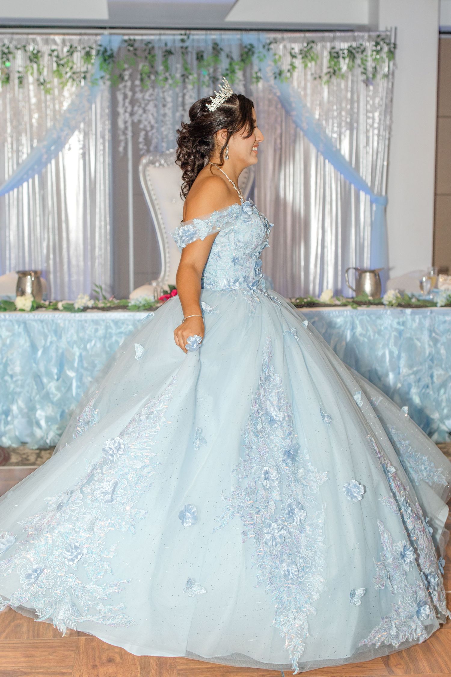 Light blue quinceañera ball gown with intricate lace appliques and full tulle skirt shown from different angles.