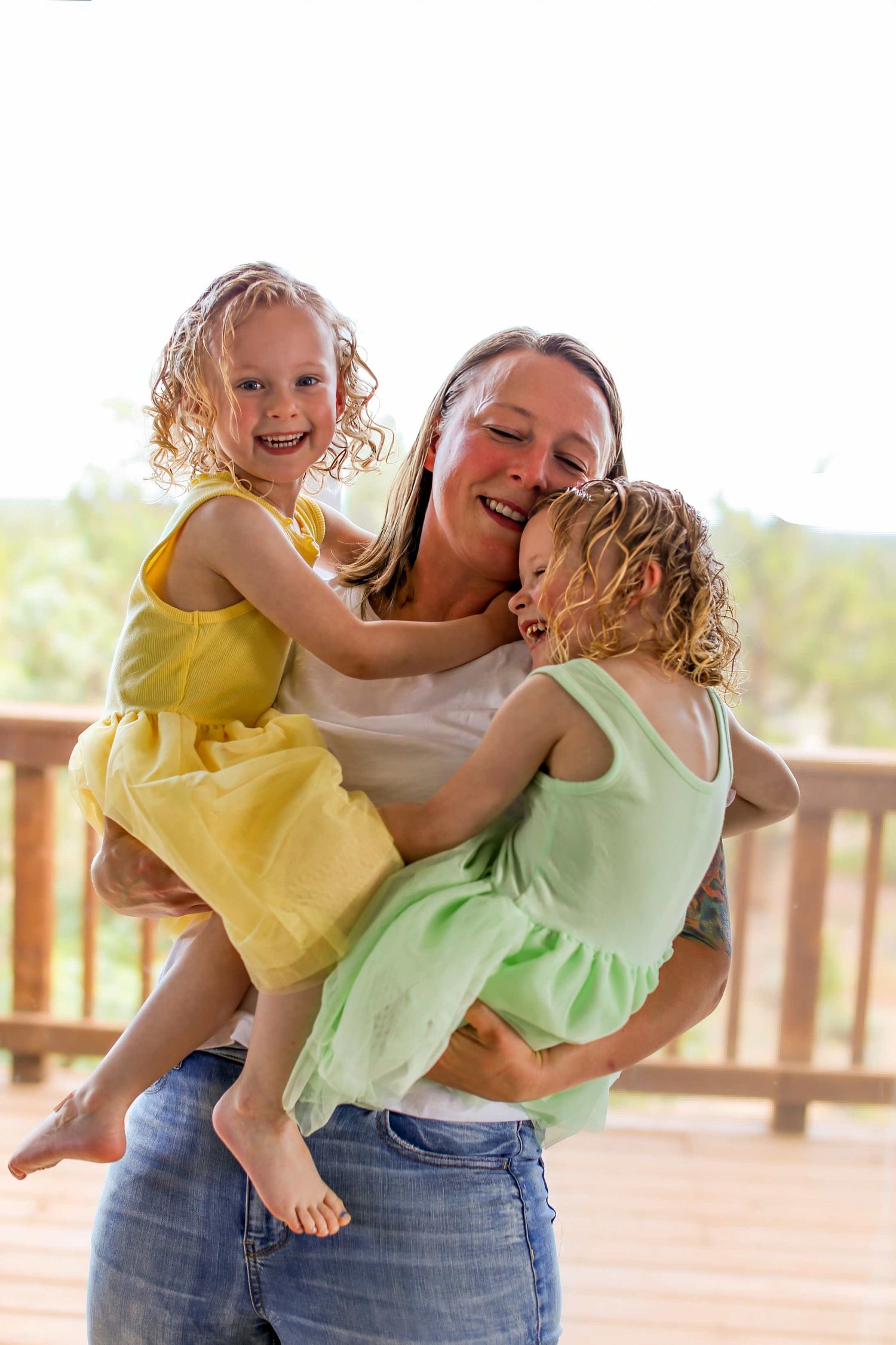 Three sequential photos show a joyful moment of playful interaction and laughter on an outdoor wooden deck. Bend Oregon