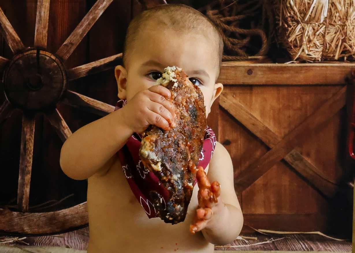 Series of close-up shots showing a child enjoying a chocolate-covered dessert treat.