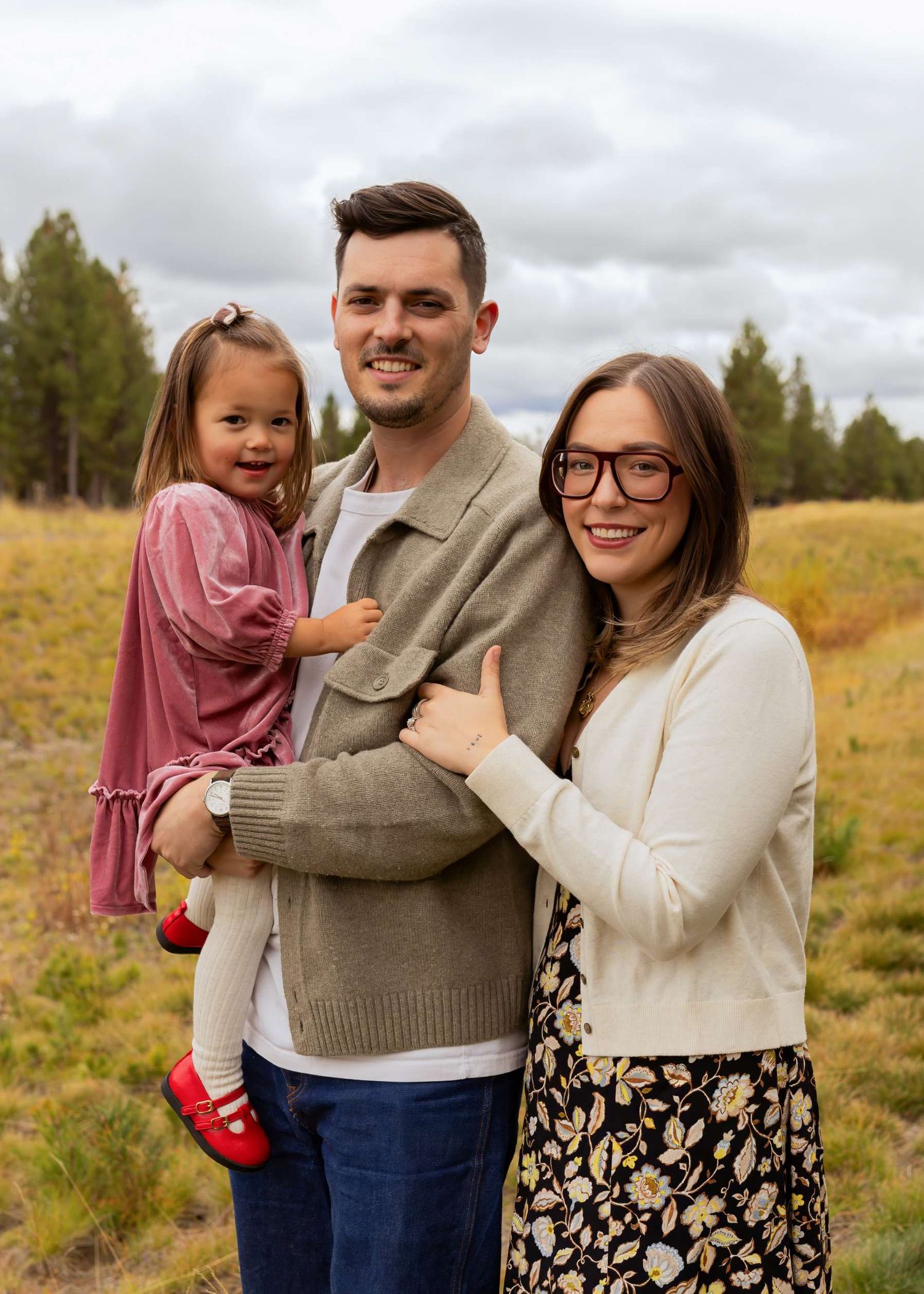 A family photo sequence in a sunny autumn field showing candid moments and warm smiles.