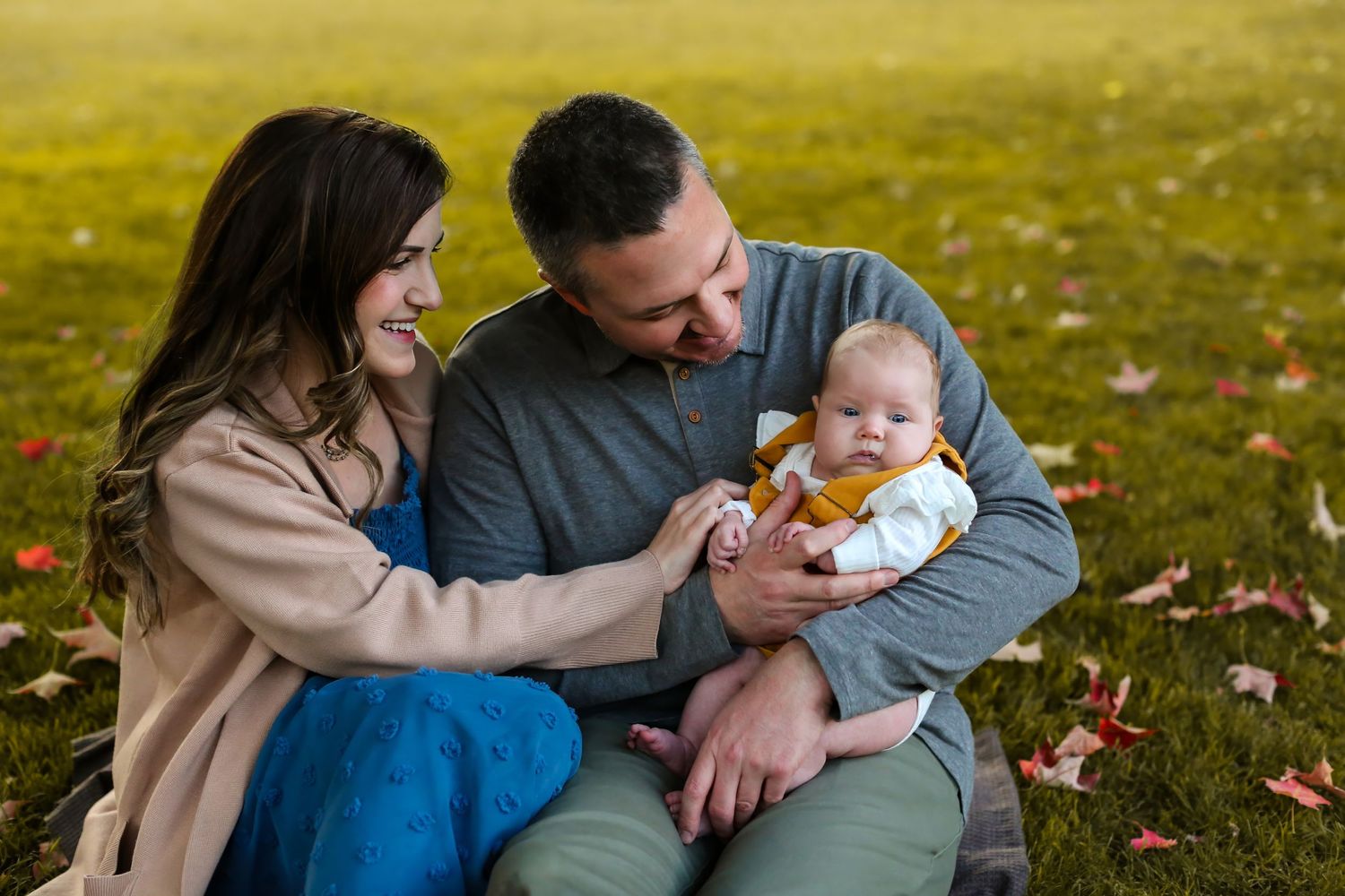 dad-holding-daughter-mom-smiling-at-her-bend-oregon