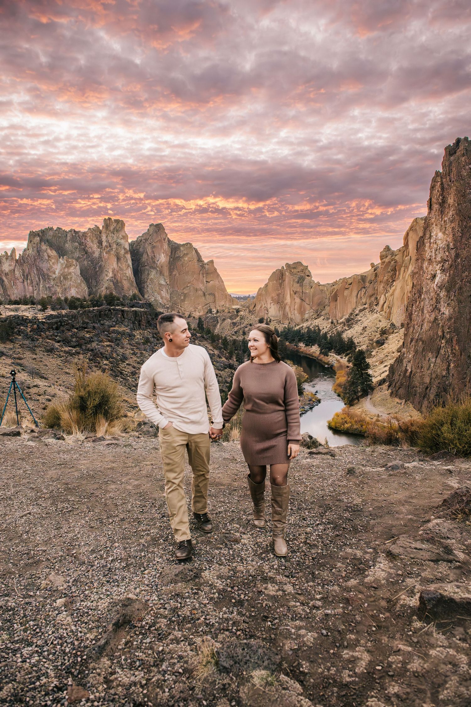 A couple walks together at sunset at Smith Rock State Park in Oregon.