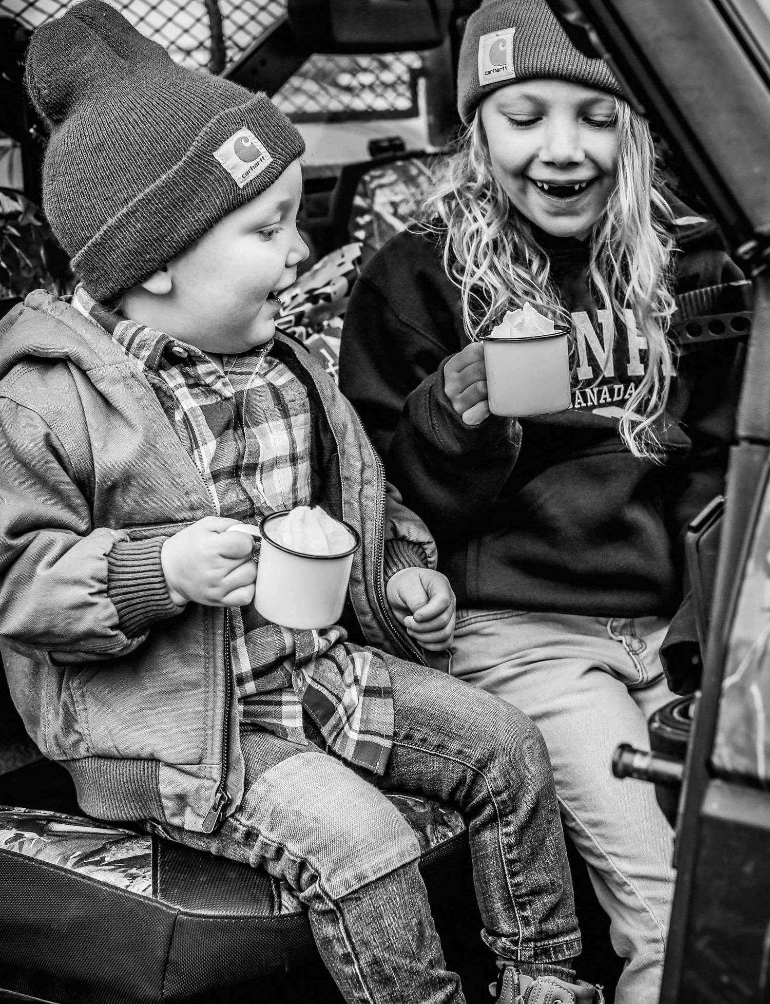 Black and white photo series showing children in winter hats drinking hot beverages from mugs outdoors. Redmond Oregon