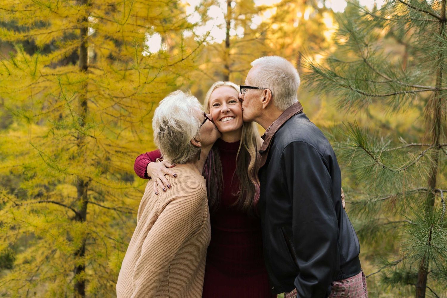 A romantic photoshoot in a golden forest during sunset with warm autumn colors.