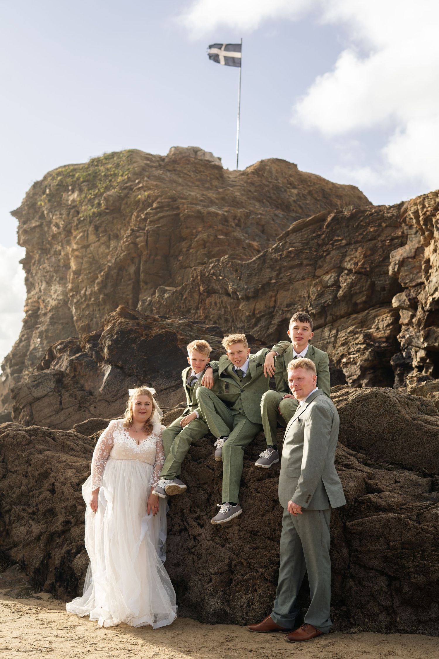 A family photo on Perranporth beach, following a small wedding in Truro, Cornwall.