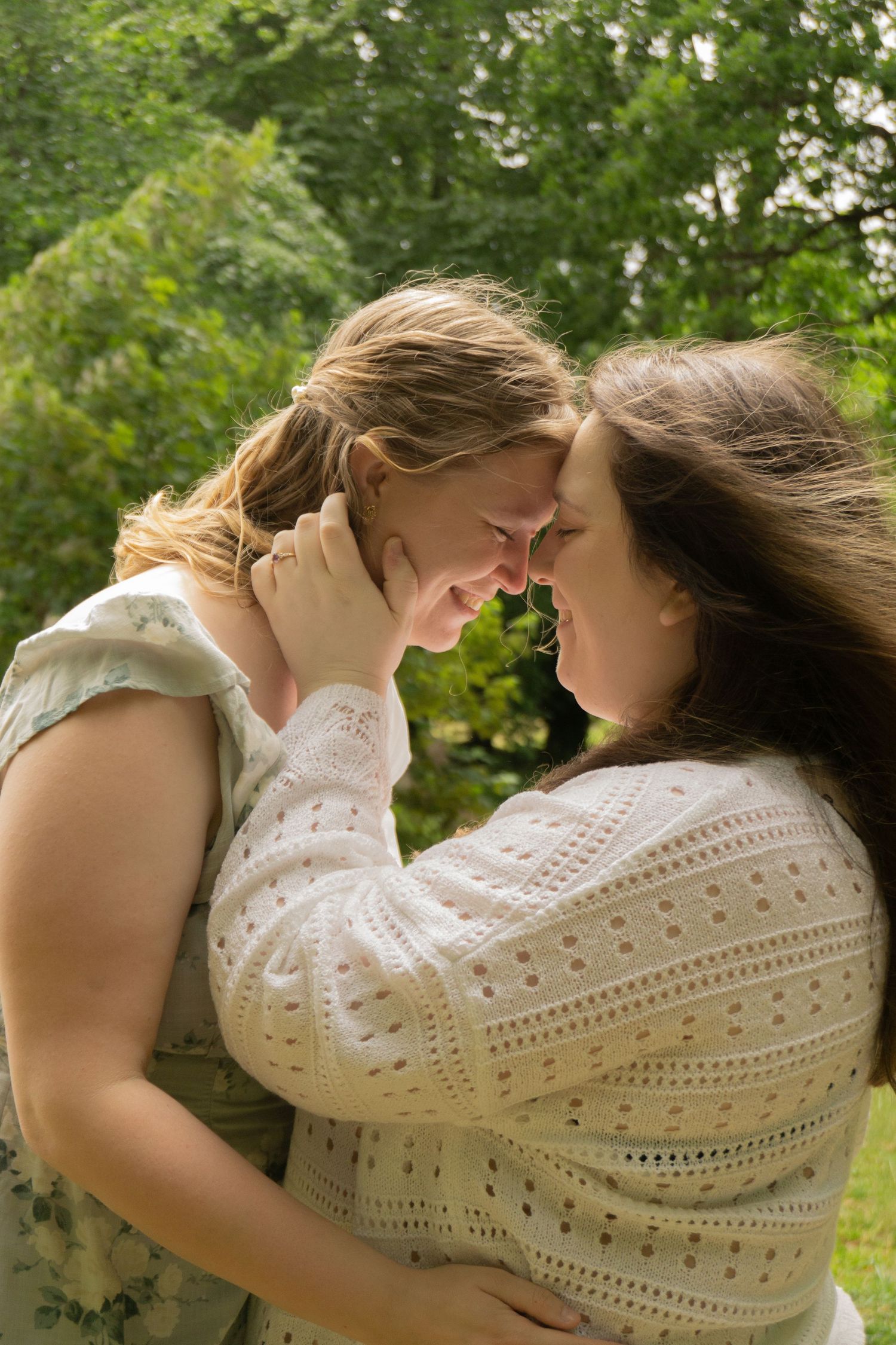 A lesbian couple embracing during their engagement outside of Exeter Registry office in Devon, Cornwall