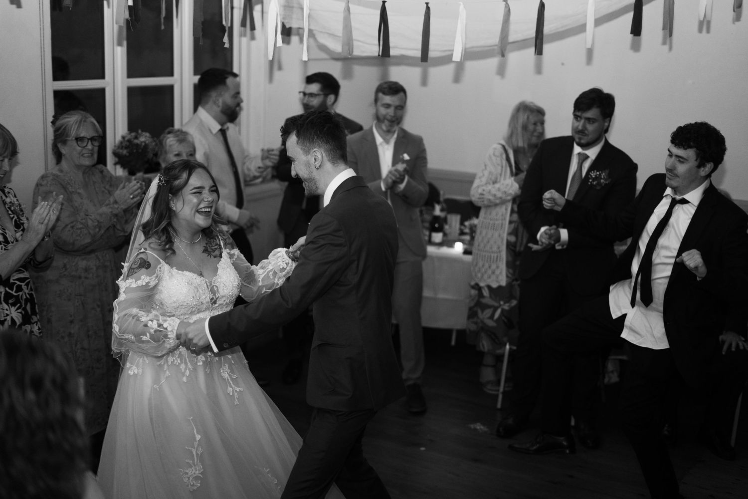 A bride and groom sharing their first dance at their wedding reception in Berrynarbor, North Devon.
